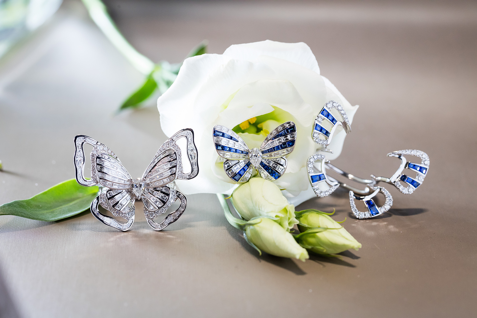 Stenzhorn Butterfly Lovers rings in diamonds and sapphires, with removable 'kimono' ring jackets in white gold
