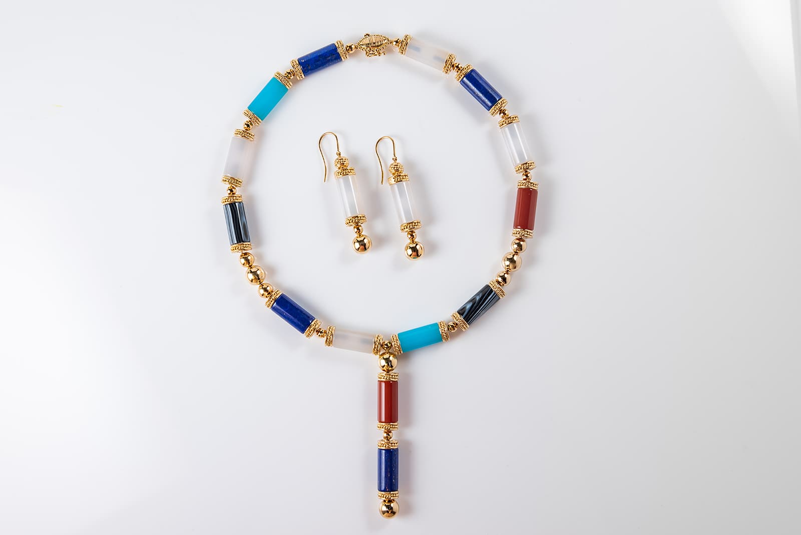 WITR Jewellery necklace with lapis lazuli, turquoise, rock crystal, carnelian and banded agate, and earrings with rock crystal, both in yellow gold