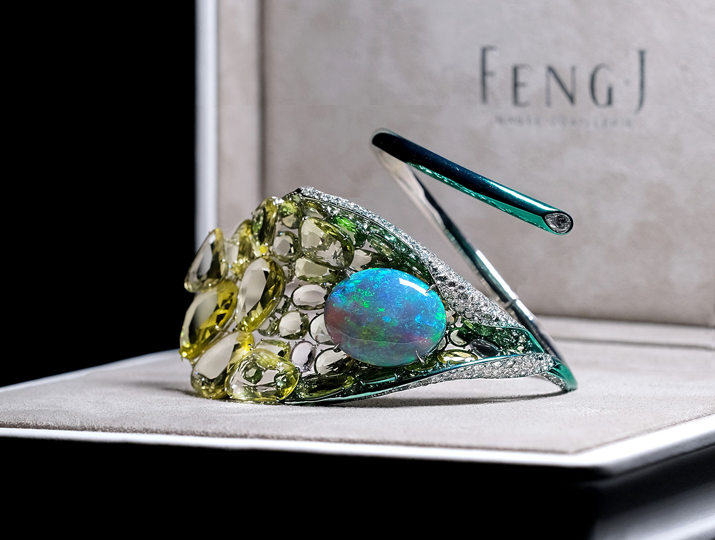 Feng J. Calla Lily bangle with 20.95ct black opal, double rose-cut yellow sapphires and tsavorites, emeralds and diamonds in electroplated gold