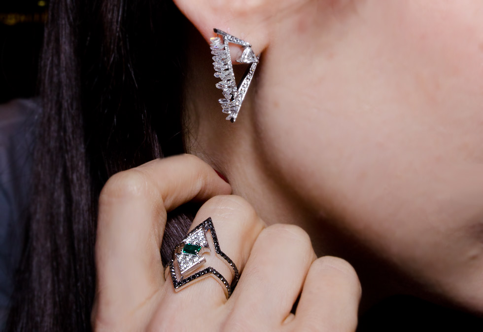Nikos Koulis ring with emeralds and diamonds and diamond earrings