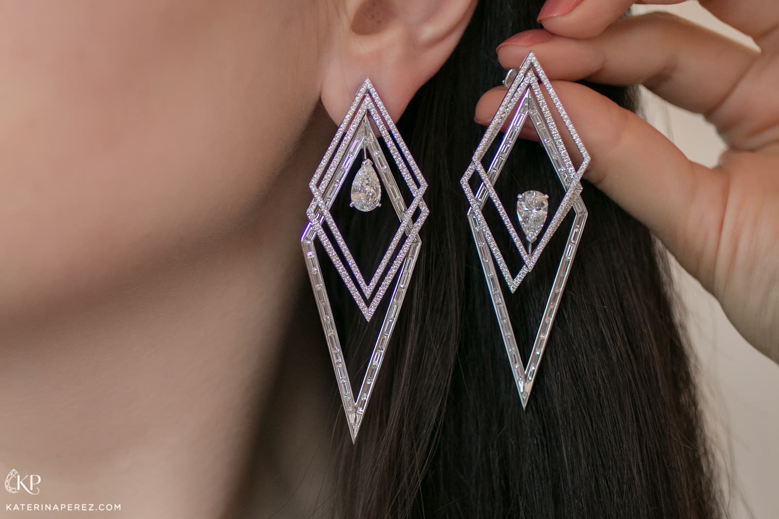 Messika Voltige Trapézistes high jewellery diamond earrings. The geometric lines overlap and intertwine, displaying mesmerising movement