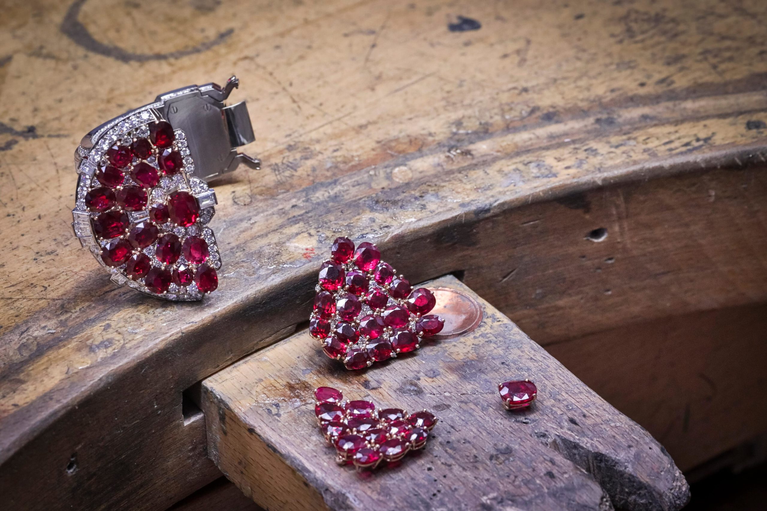 The 72 Burmese rubies in Van Cleef & Arpels' Rubis en Scene high jewellery cuff are set in rose gold prongs to enhance their opulent hue