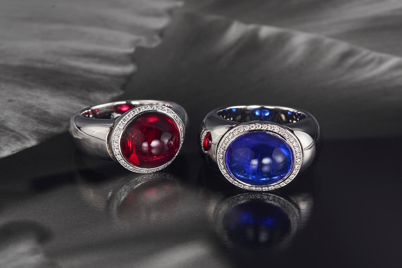 Leyser rings showcasing magnificent coloured gems - a cabochon rubellite and tanzanite 