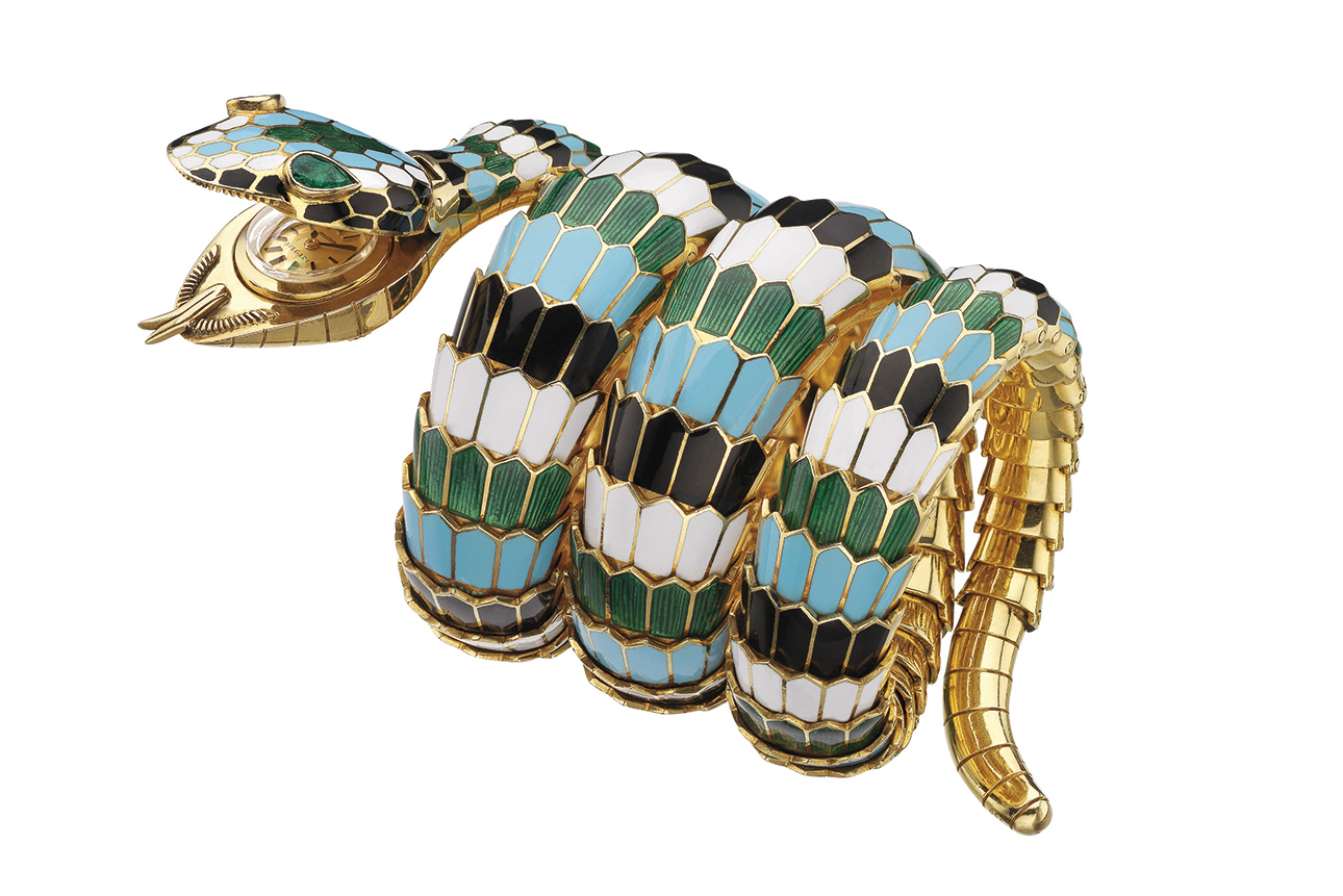 This Bvlgari Serpenti Tubogas bracelet-watch in gold with polychrome enamel and emeralds was designed in 1967