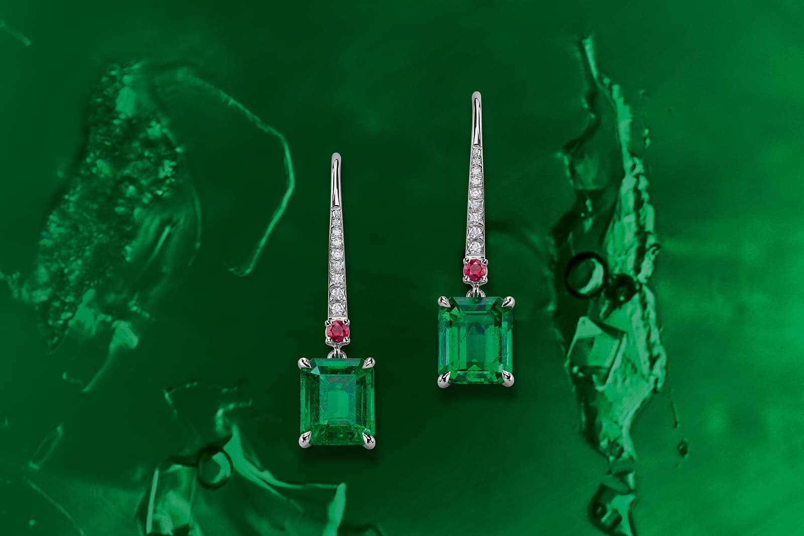 Gübelin Jewellery earrings from the Ancient Path collection, set with emerald-cut emeralds and diamonds