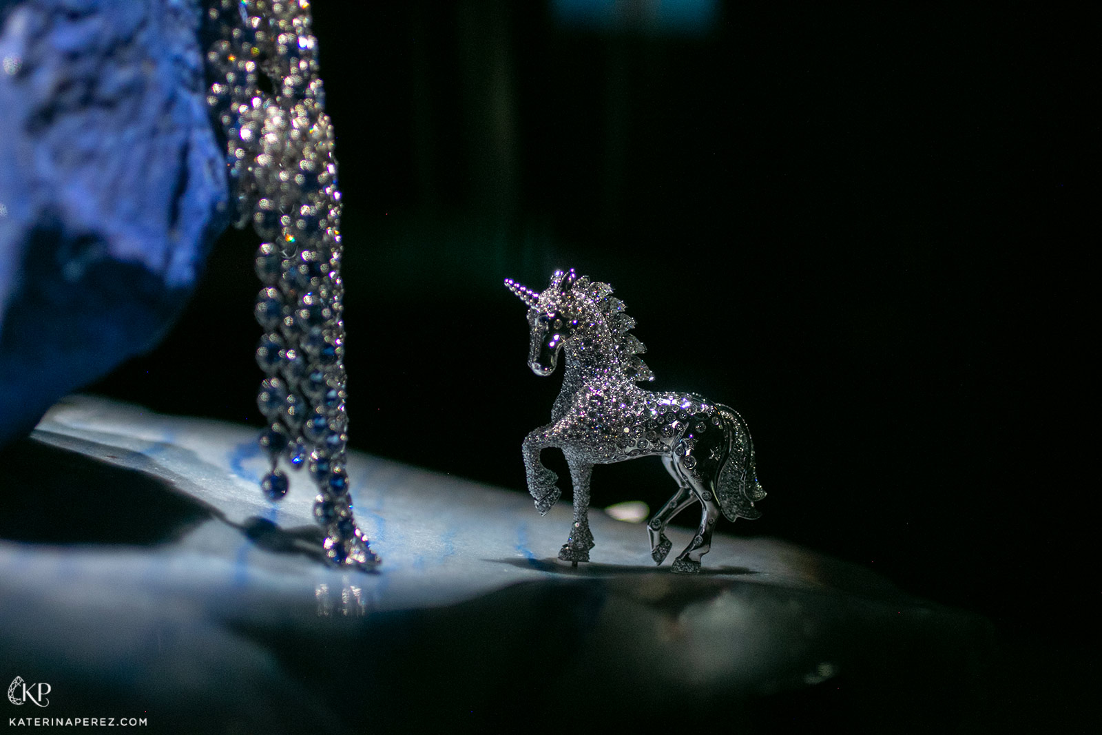 The body of the white gold unicorn shines with round diamonds, while its mane is formed of glittering pear shape diamonds