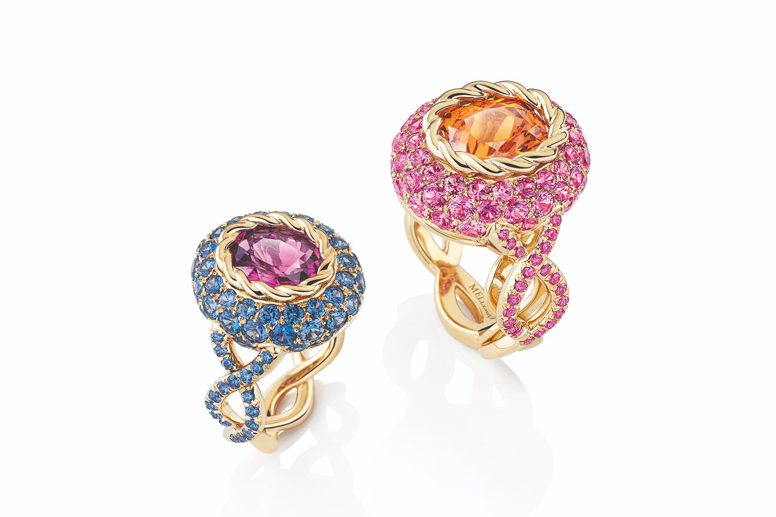 Two colourful rings from MELLERIO's new Color Queen collection, set with a central purple sapphire and spessartite garnet