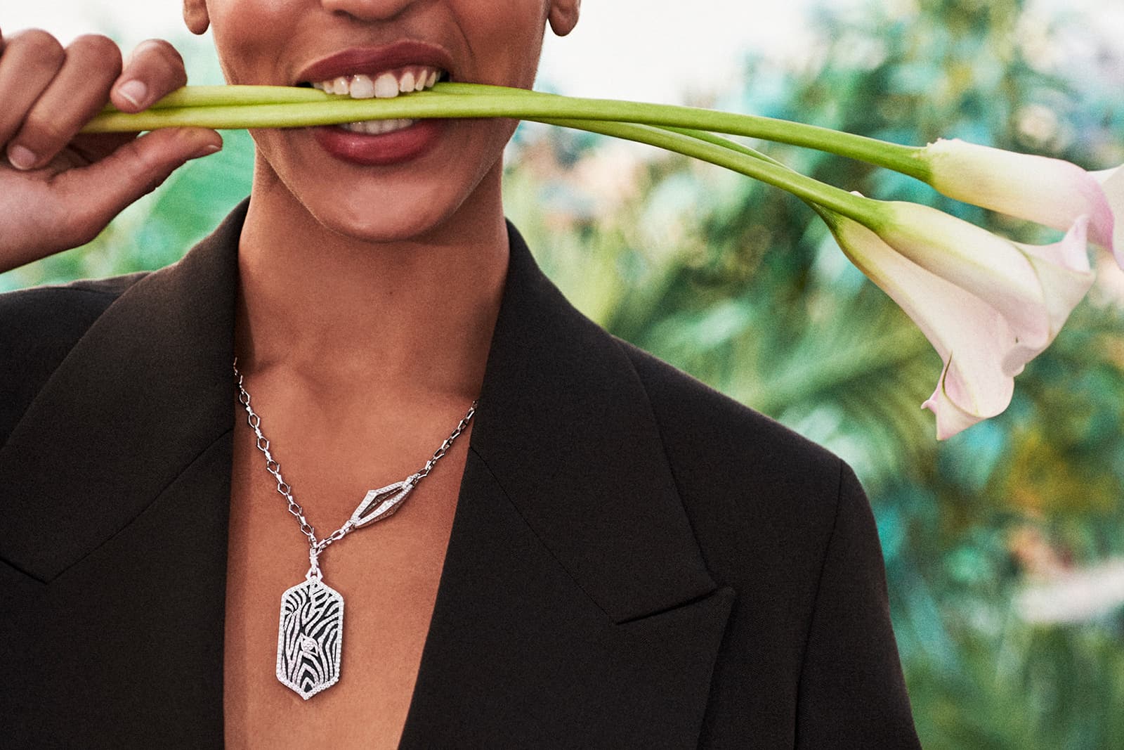 Model Indira Scott wears Sara Weinstock's zebra-inspired pendant