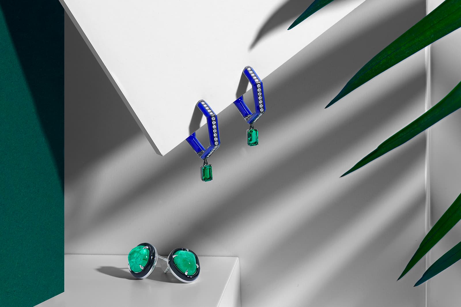 Two Muzo emerald pieces by Katherine Jetter as part of the collaboration, including the Limited Edition drop hoop earrings and the Black Enamel studs with tumbled Muzo emeralds totalling 7.88 carats