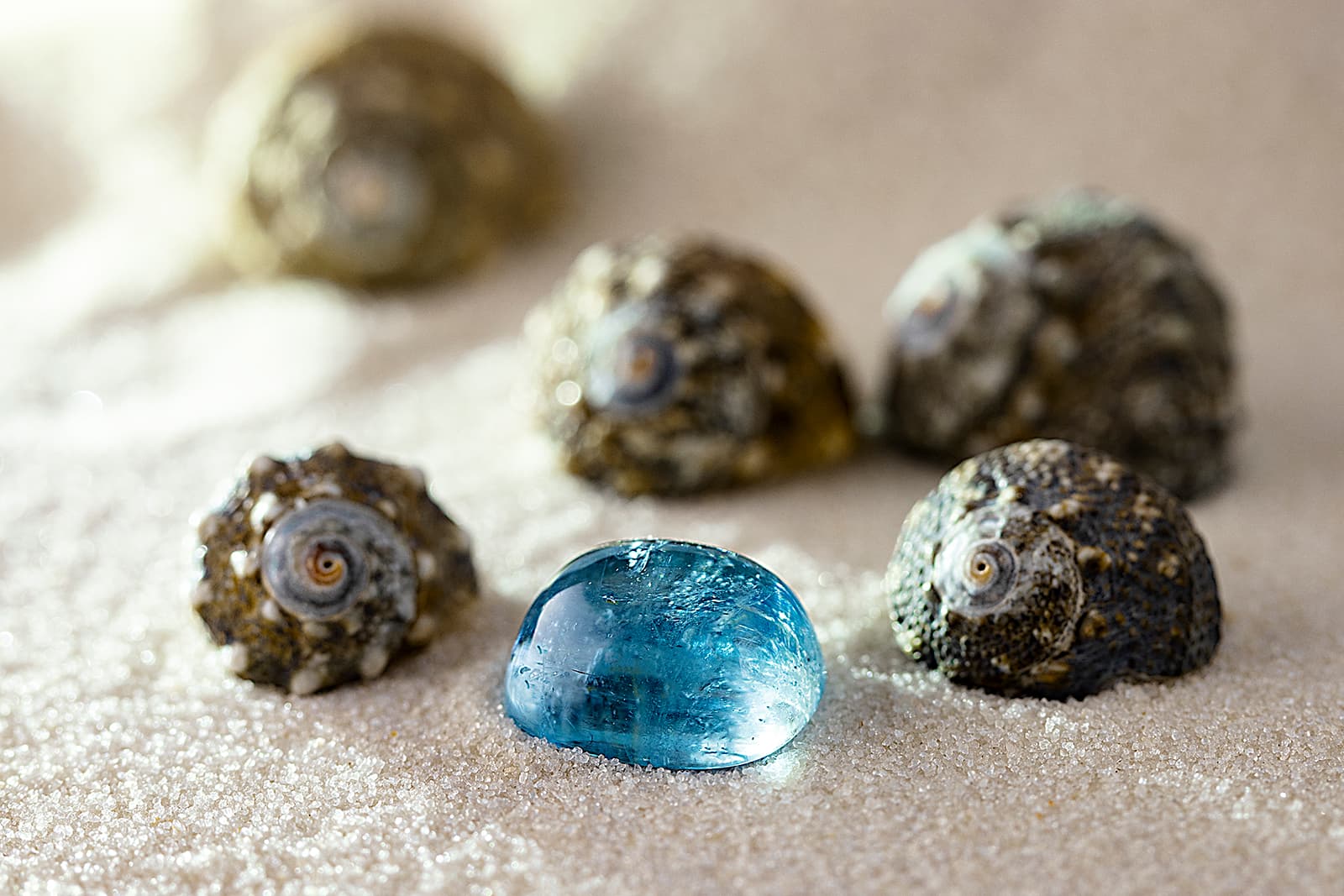 A light blue cabochon gemstone offered by specialist gemstone cutting business, Gebrüder Meelis