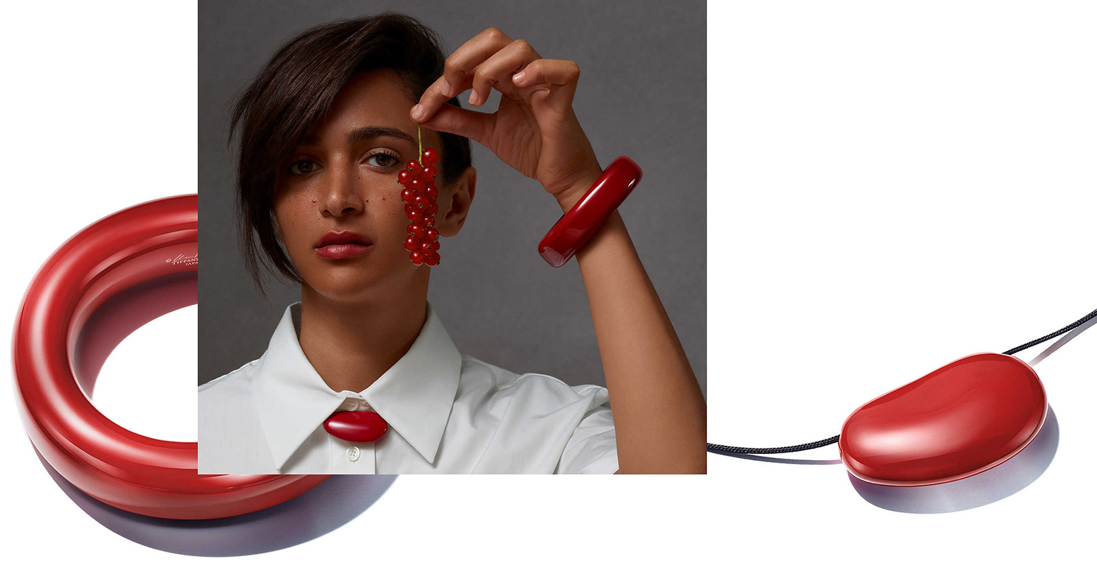 Elsa Peretti Lacquer jewellery creations, including a red lacquered hardwood bangle and Bean pendant, styled by Kate Young for Tiffany & Co.