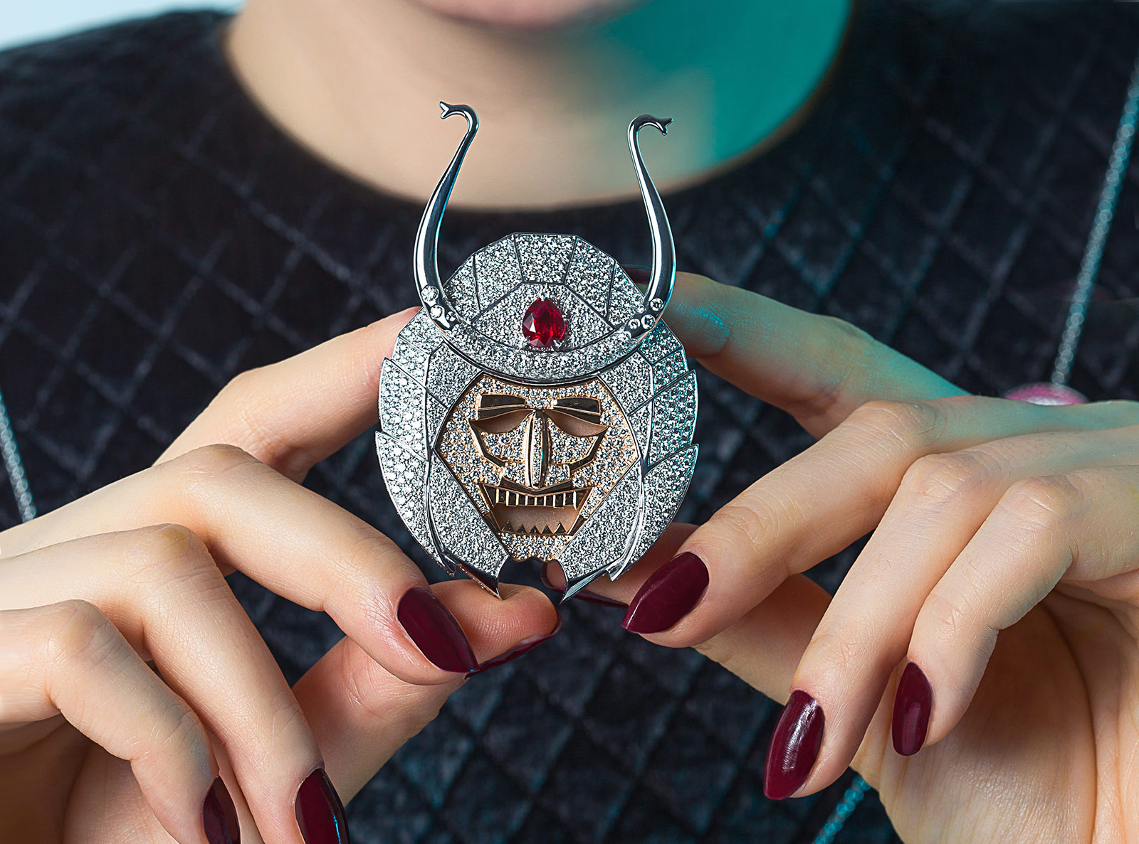 Julian Pelliccia’s Samurai belt buckle represents the helmet and mask of the Samurai warrior, complete with 764 diamonds and a natural, unheated pear-shaped ruby from Mozambique in 18k white and rose gold 