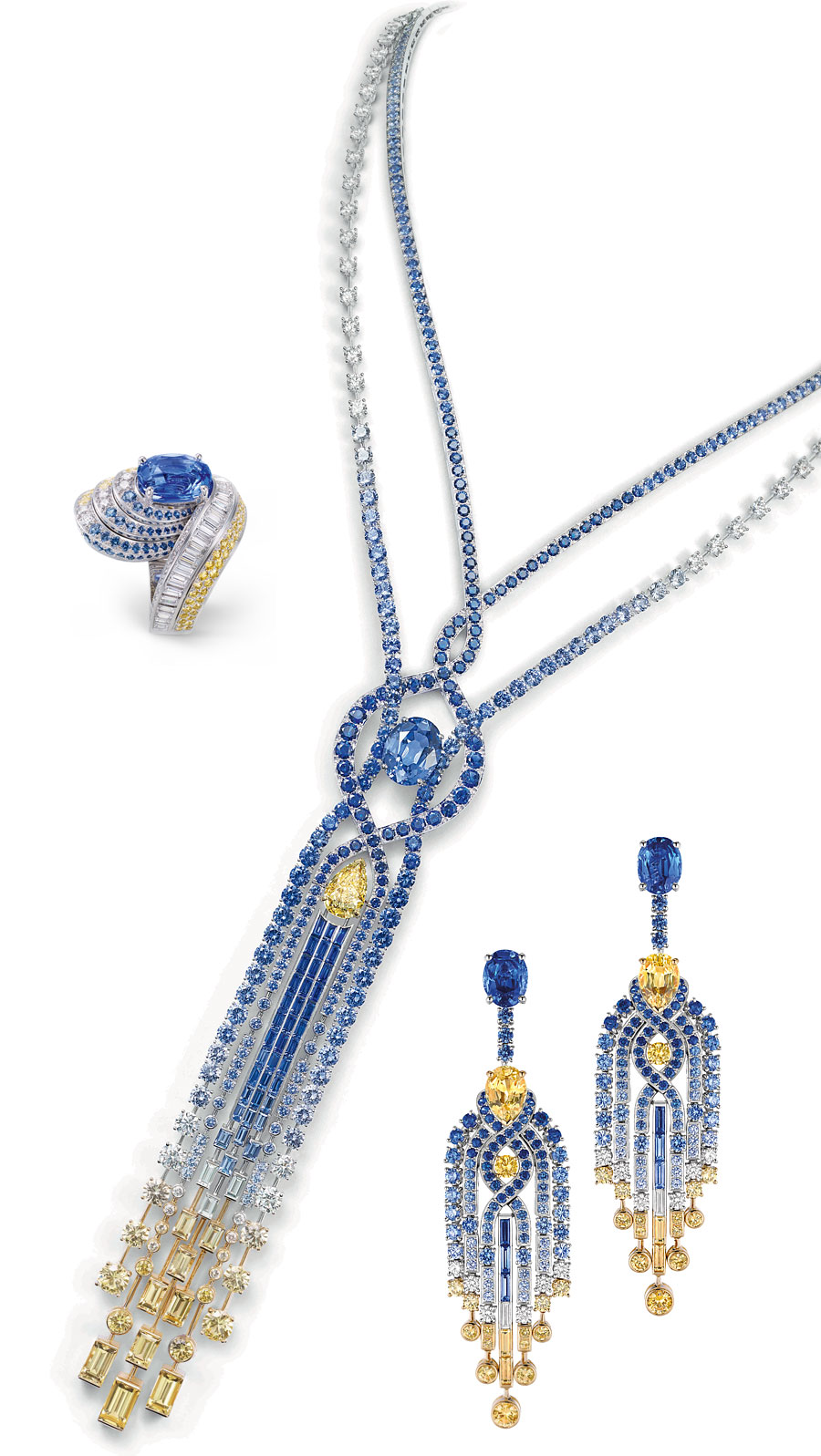 On the right you see a pair of earrings set with diamonds, round and baguette-cut blue and yellow sapphires, two pear-shaped yellow sapphires of 2.23cts and 2.51 cts and two oval-cut blue sapphires from Ceylon, one - 2.72 carats, the other 3.32 carats. The necklace of sapphires and diamonds features a pear-shaped VVS1 Fancy Yellow diamond of 3.77 carats and an oval-cut blue Ceylon sapphire of 10.23 cts. The ring in white gold, set with brilliant-cut, square-cut and baguette-cut diamonds, round blue and yellow sapphires and an oval-cut 5.10 cts sapphire from Madagascar.