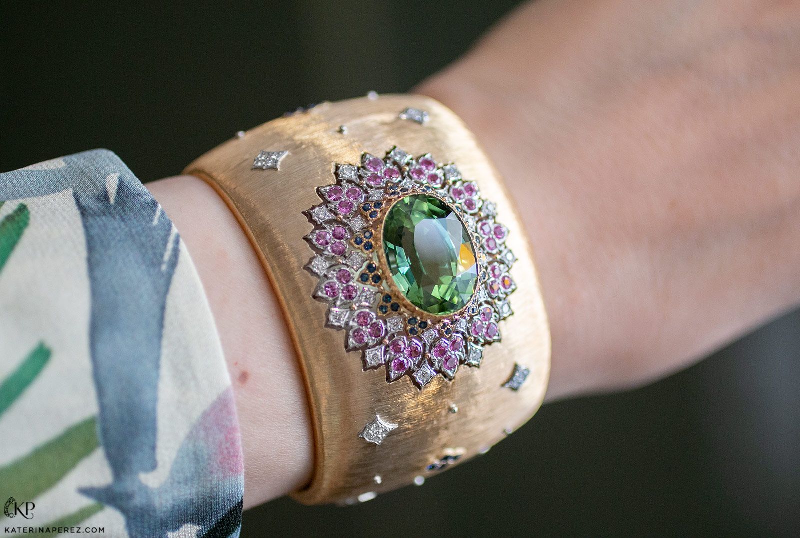 The Buccellati Lilium cuff bracelet with diamonds, pink and blue sapphires and a 20.11 carat tourmaline in 18k yellow gold from the Il Giardino di Buccellati High Jewellery collection