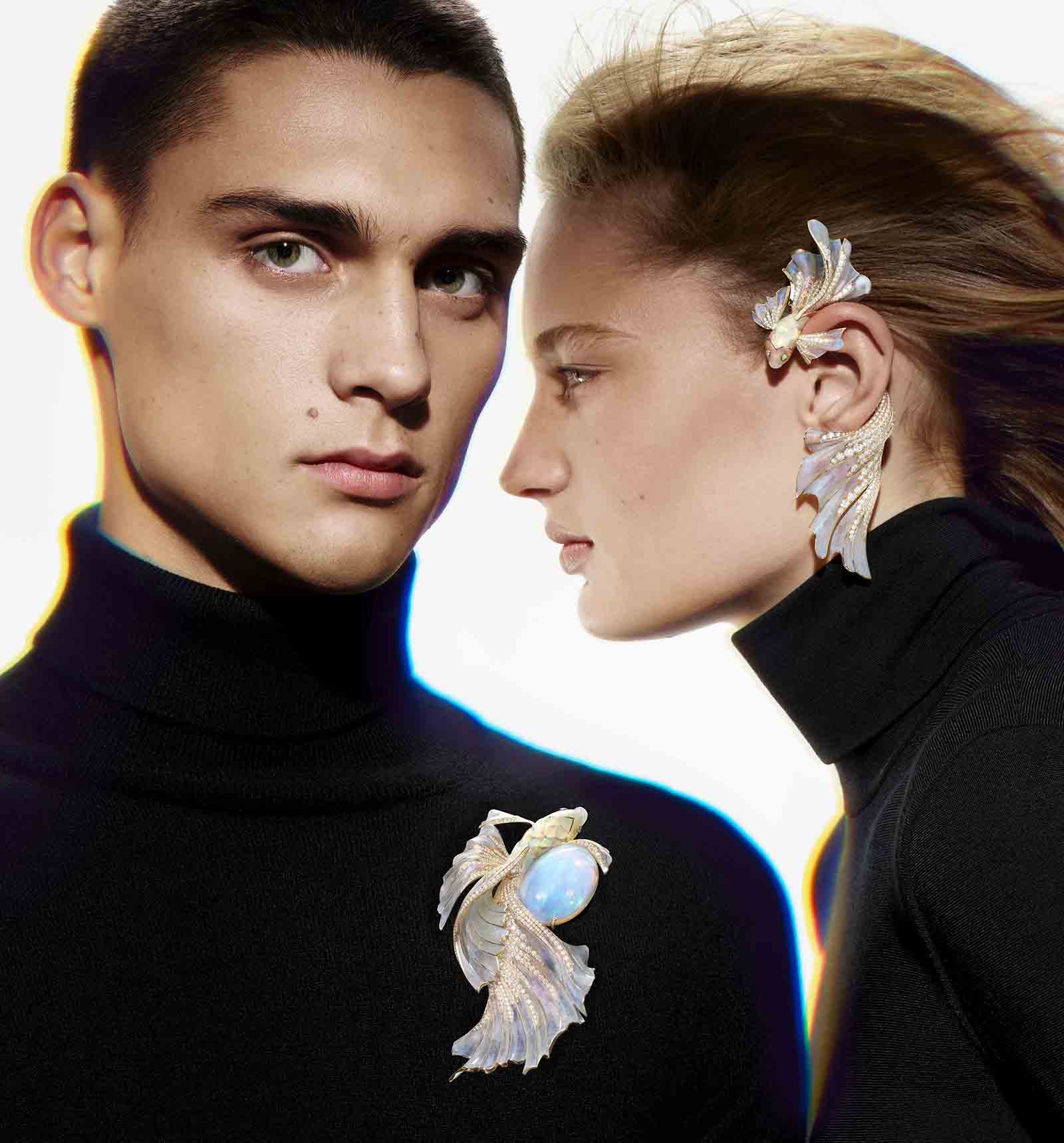 Models wear the Opalsecence brooch and ear pendant set with opals and diamonds from the Boucheron Holographique High Jewellery collection