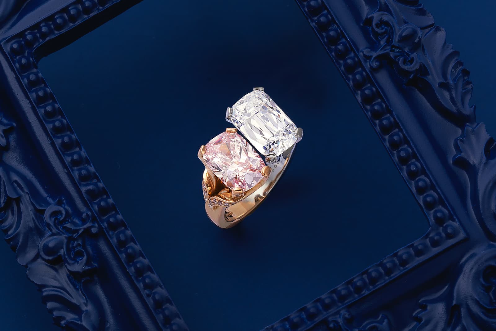 A cushion-shaped fancy purplish pink diamond, weighing 2.52 carats, set with a 3.23 carat Ashoka-cut diamond in a ring by Boodles, featured in the Bonhams London Jewels auction of September 2021