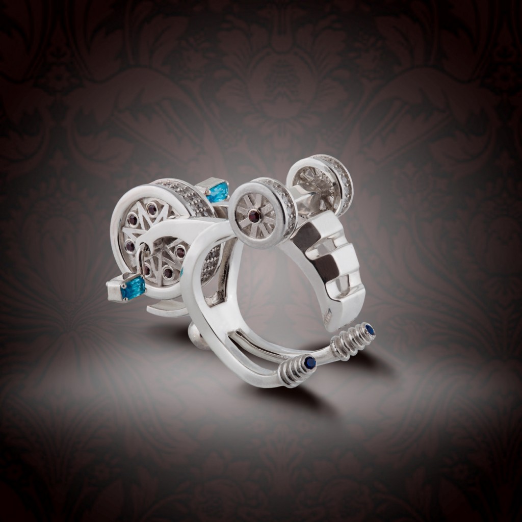 Prytula Bicycle ring with sapphitres, rubies and diamonds upside down