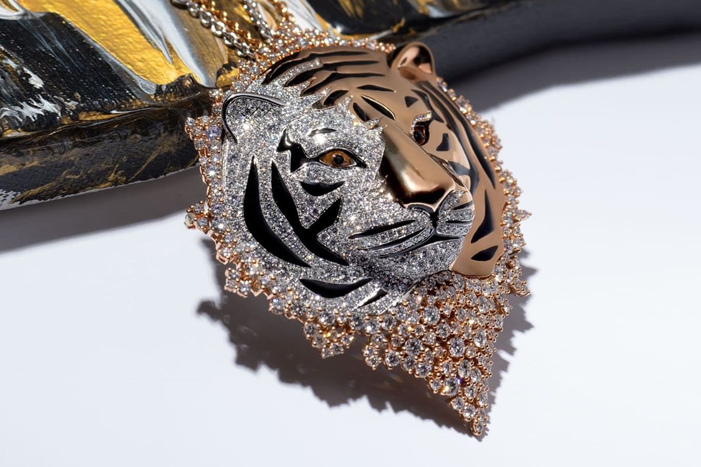 Stenzhorn Savages Feline pendant in 18k gold with diamonds and yellow sapphires