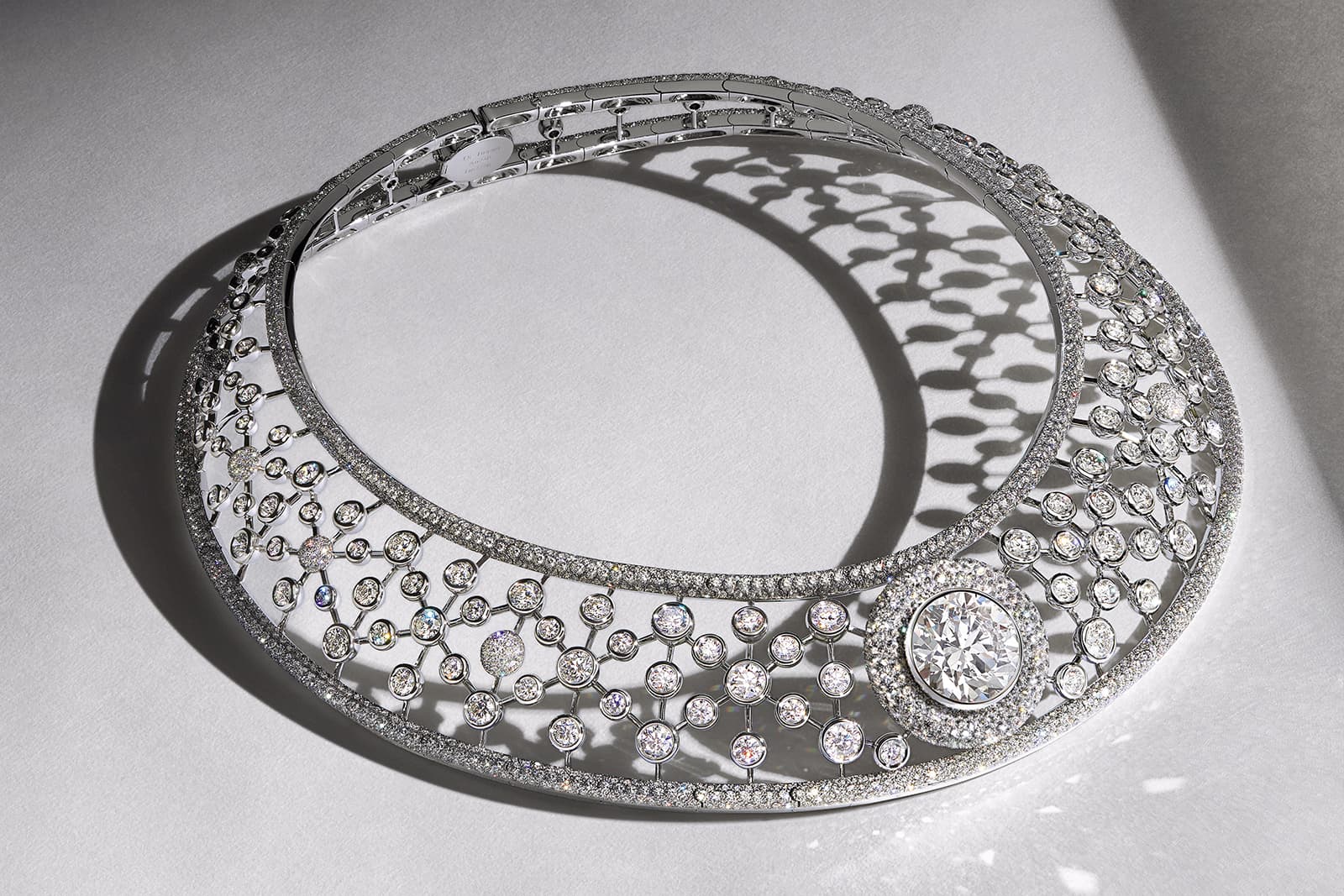 De Beers Jewellers The Alchemist of Light High Jewellery Atomique collar necklace with an 18.57 carat internally flawless diamond at its centre and a further 1,907 diamonds