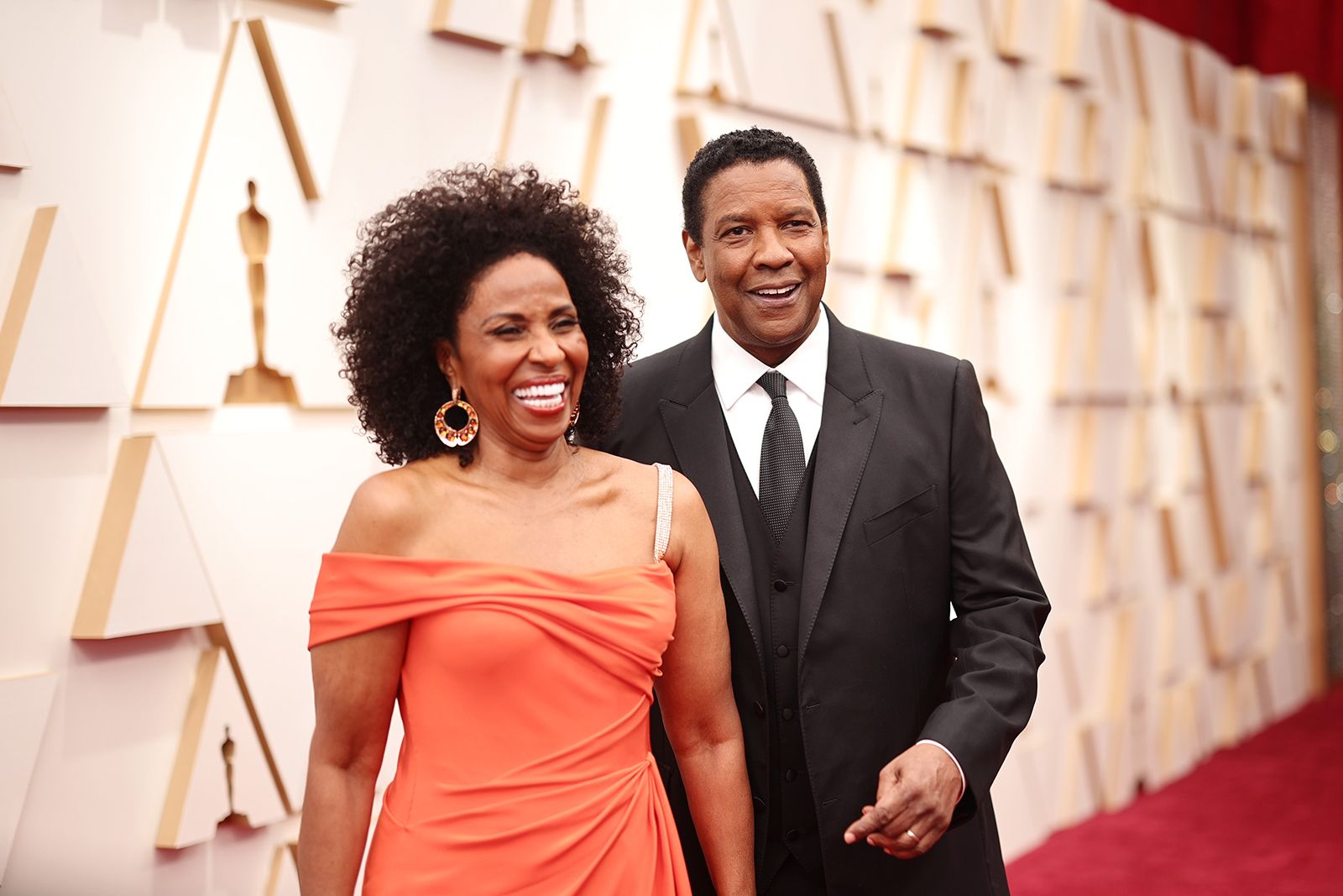 Pauletta Washington wears Fawaz Gruosi Amber earrings in rose gold set with cabochon amber, brown diamonds and tsavorites at the Oscars 2022