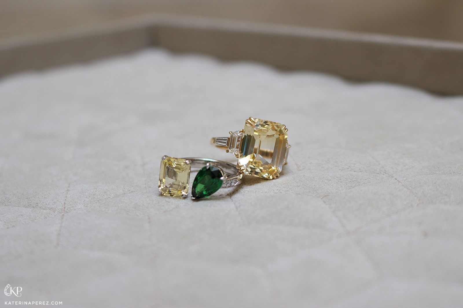 Maison Avani Toi et Moi ring with a 4.50 carat yellow sapphire and a 2.15 carat pear-shaped tsavorite alongside a yellow sapphire ring
