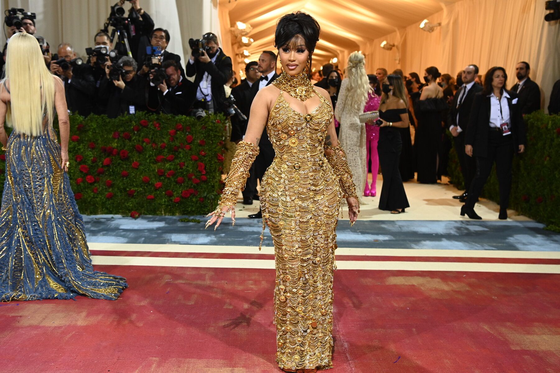Cardi B wearing a golden choker necklace by Versace to the Met Gala 2022. Photo credit: The New York Times