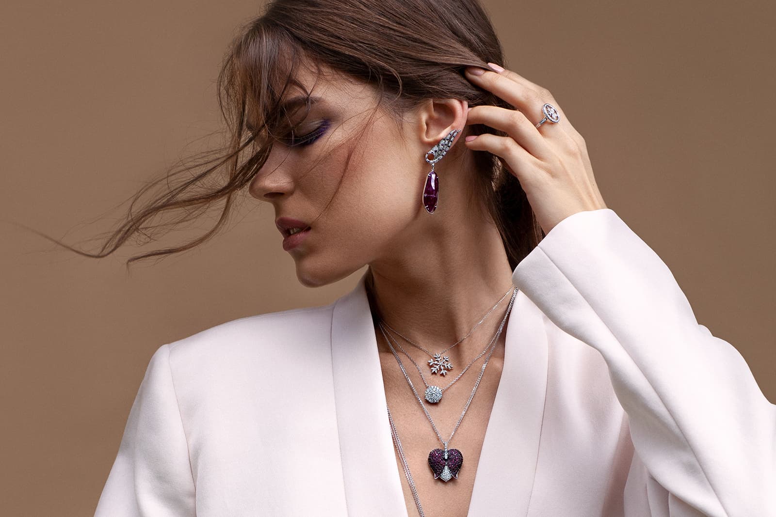 Maison Mirath jewellery including the Maple Leaf Ring with diamonds, the Wings of Love earrings set with natural ruby crystals, the Diamond Sun pendant with illusion-set diamonds and the Flowing Heart pendant with diamonds and rubies