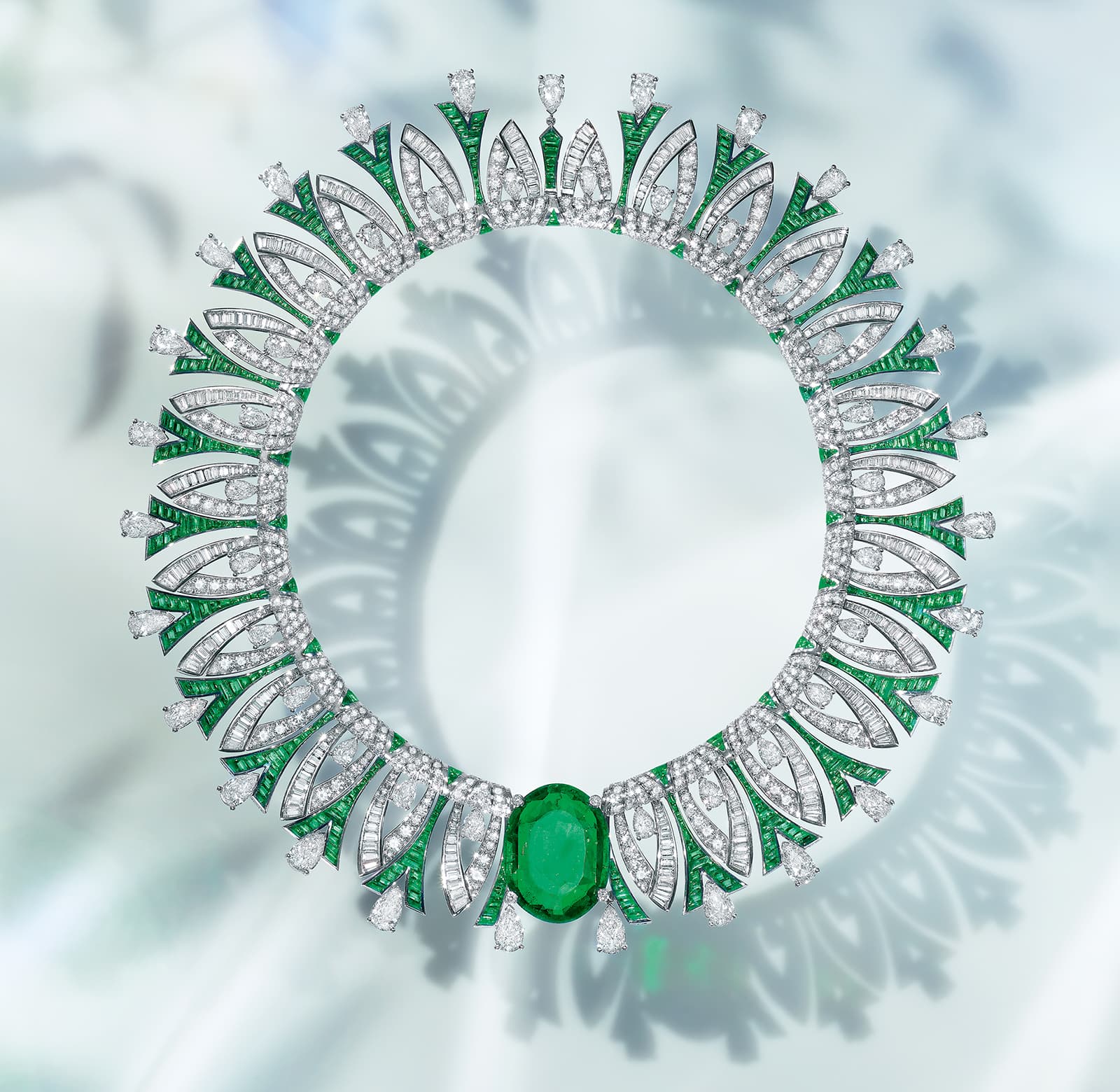 Bulgari Tribute to Paris necklace from the Eden The Garden of Wonders High Jewellery collection, set with a 35.53 carat oval-shaped Colombian emerald cabochon, six pear-shaped diamonds of 6.08 carats, plus buff top emeralds, fancy-cut diamonds and pavé-set stones