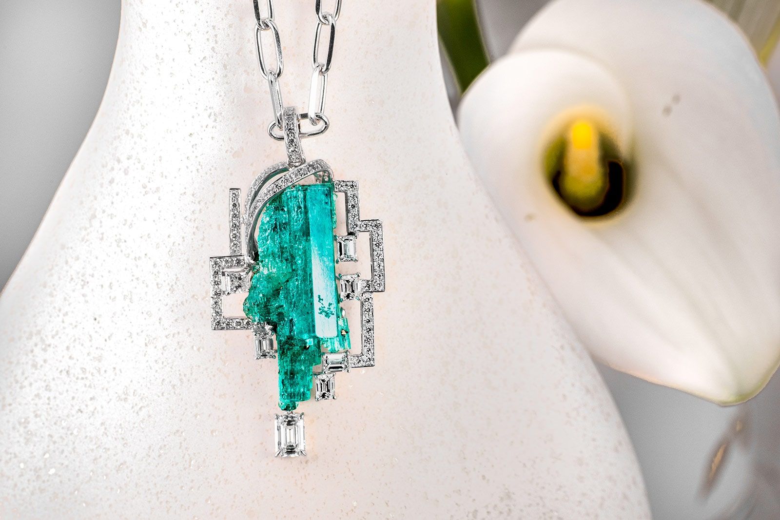 Qiu Fine Jewelry necklace with a 42 carat rough Colombian emerald in a diamond-set geometric frame
