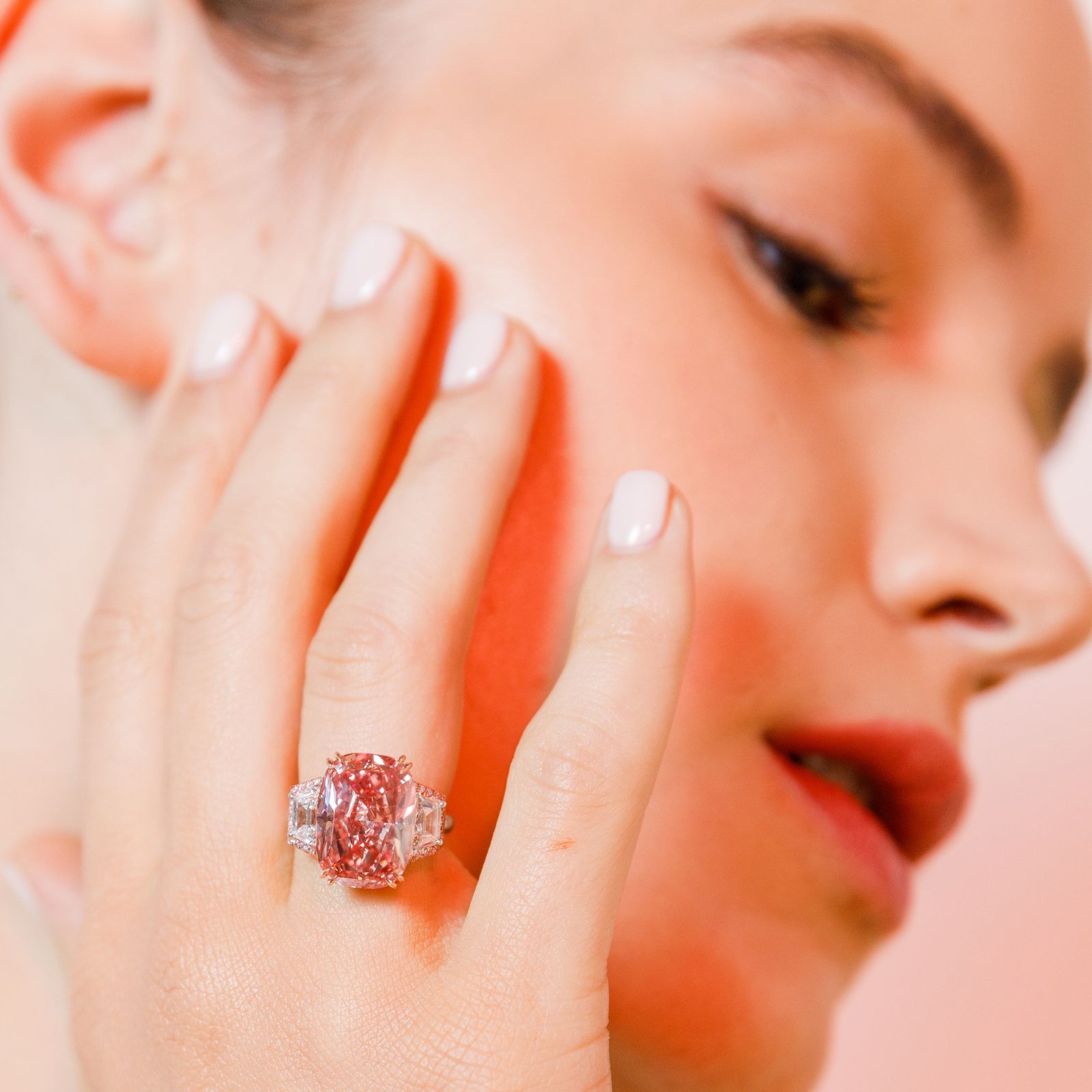 Model wearing the Williamson Pink Star diamond, an 11.15-carat cushion-cut internally flawless fancy vivid pink diamond