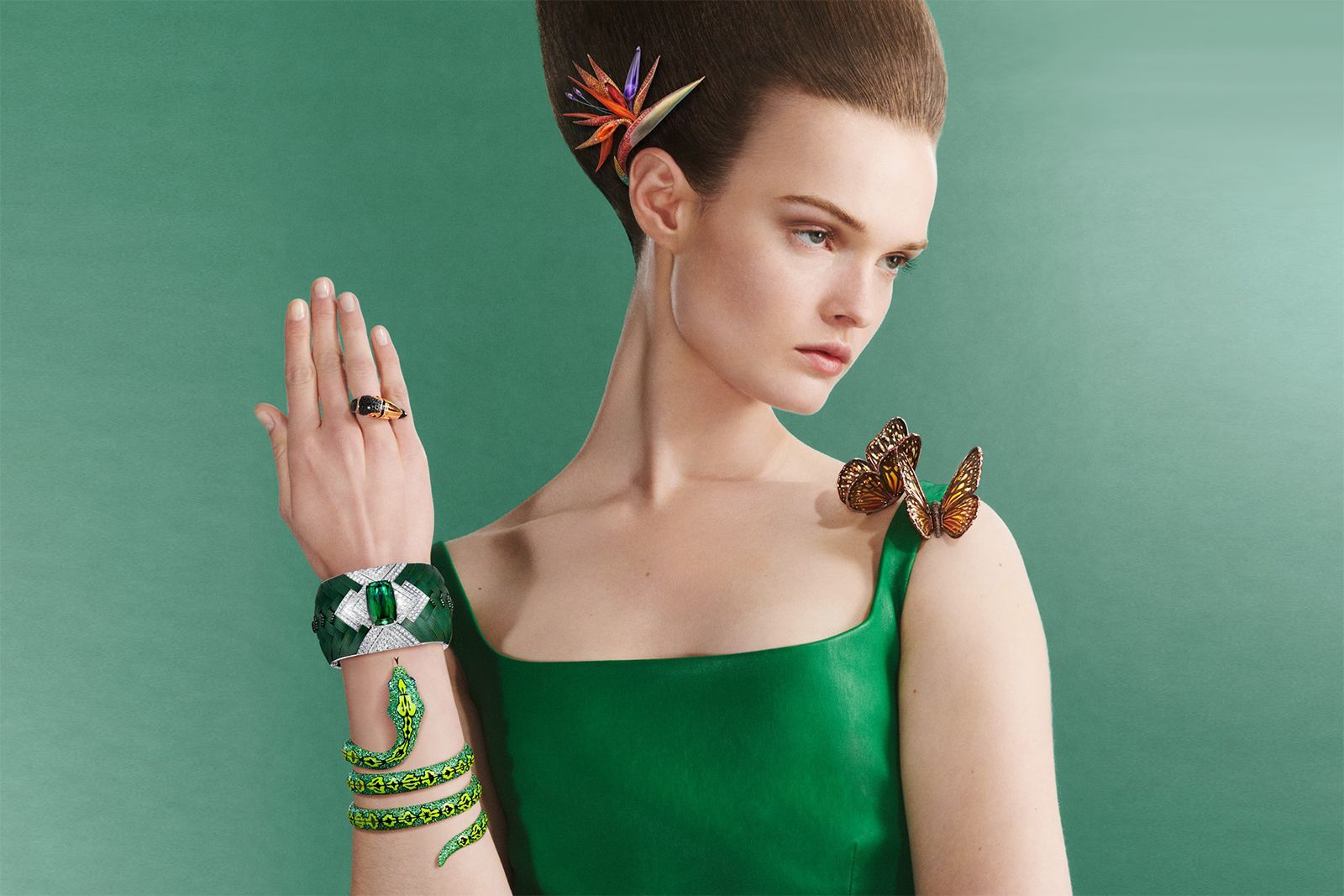 Boucheron tourmaline, diamond, aluminium, white gold, amethyst, sapphire, lacquer, titanium, citrine, rubellite, spinel, tsavorite, onyx and natural butterfly wings Fleur de Paradis head jewel, Papillon brooch, Toucan ring, Feuillage Diamant cuff, Serpent bracelet and Toucan bracelet from the Carte Blanche Ailleurs High Jewellery collection