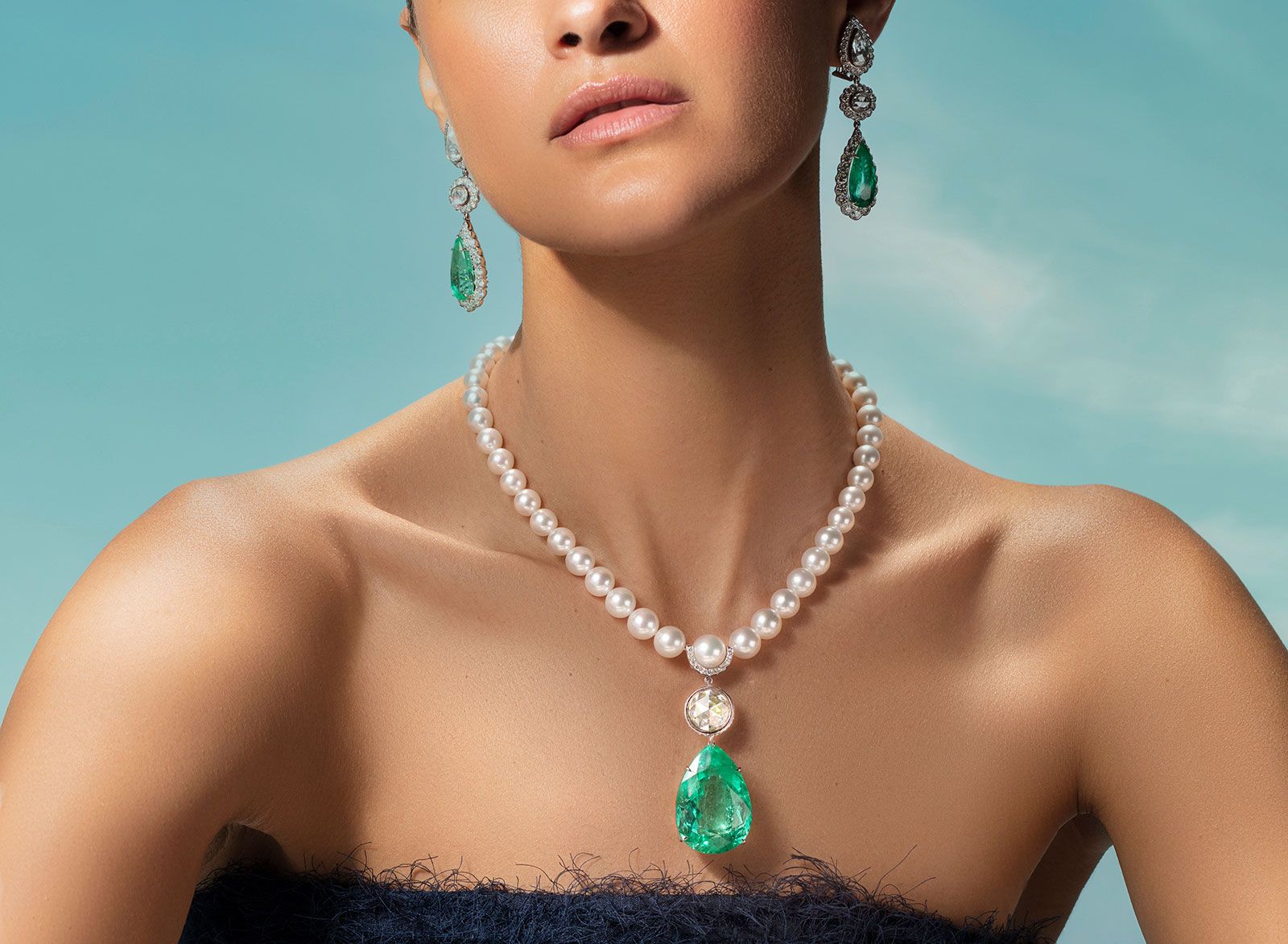 Alok Lodha necklace with a 87.51-carat Colombian emerald and 4.65 cts rose-cut diamond suspended from a string of pearls
