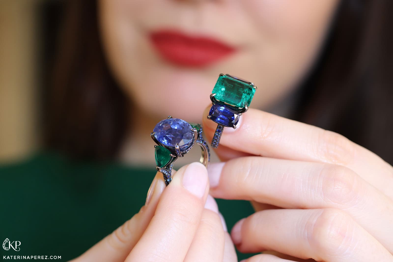 Katerina Perez holding two sapphire and emerald Bucherer Fine Jewellery Cocktail rings