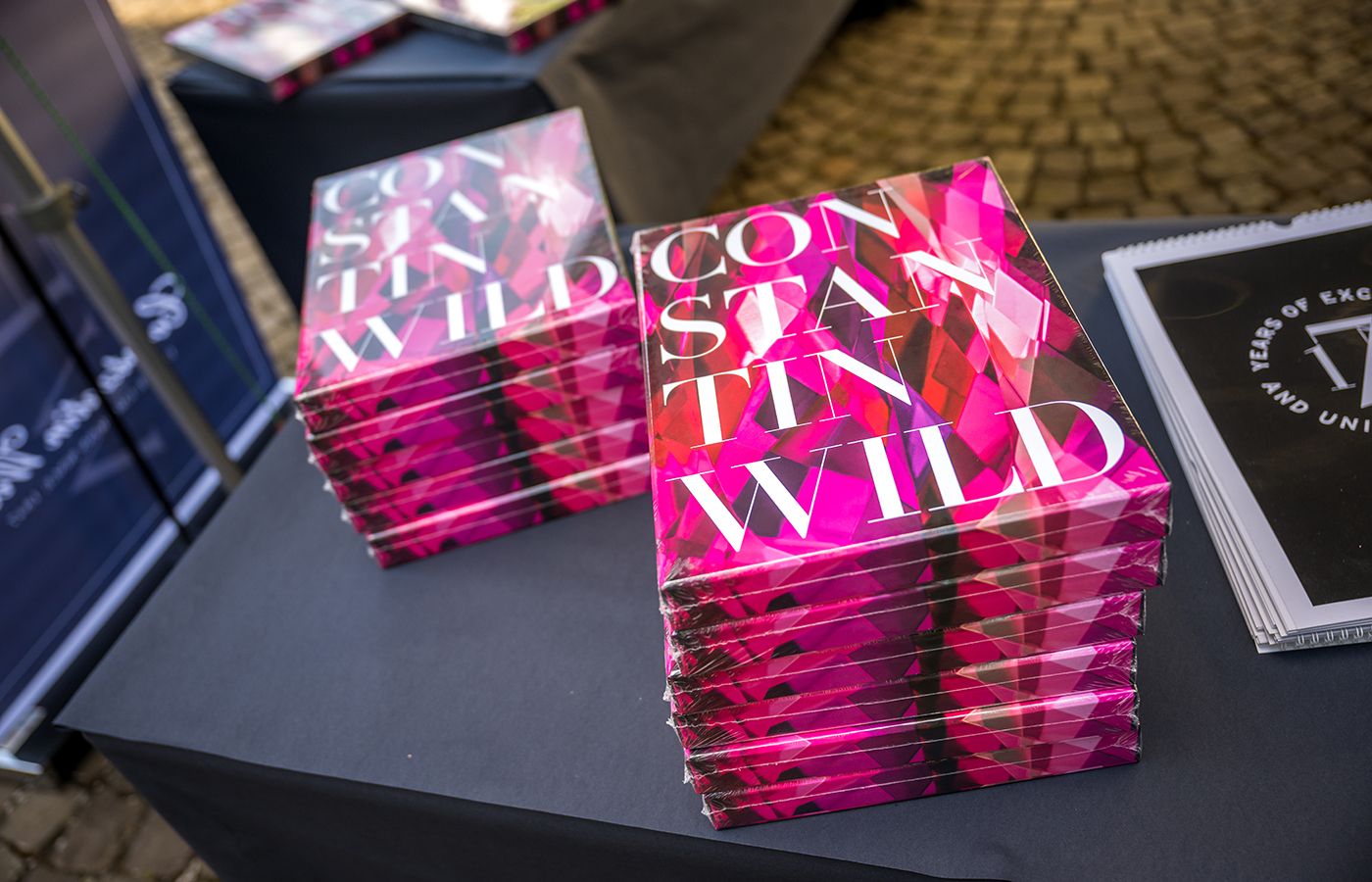 Copies of Constantin Wild's coffee table book that includes an introduction by Katerina Perez