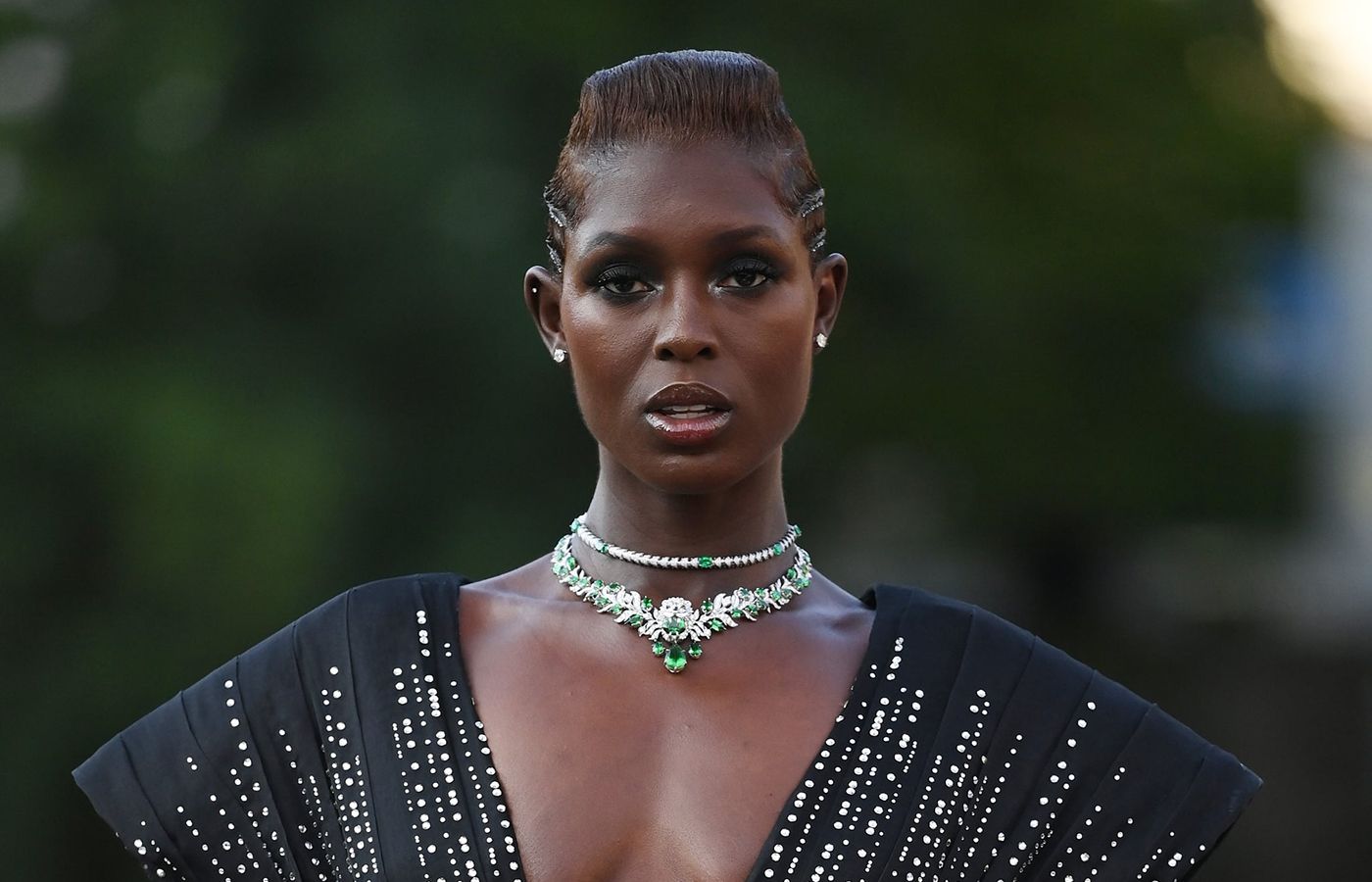 Jodie Turner-Smith at the White Noise premier at the Venice Film Festival wearing a Gucci High Jewellery necklace in white gold, tsavorites, and diamonds from the Hortus Deliciarum High Jewellery collection