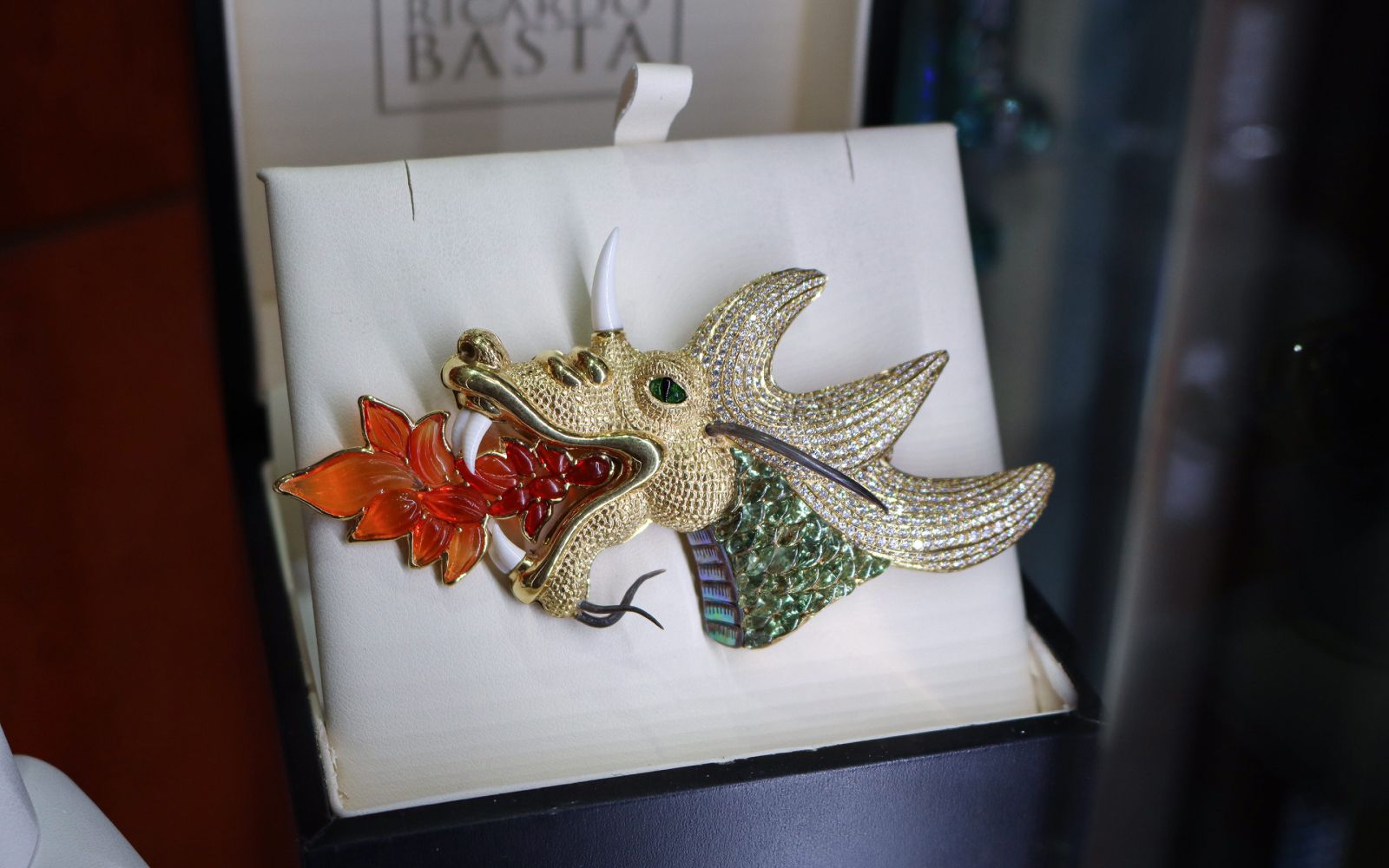 Ricardo Basta dragon brooch with hand-carved fire opal flames, green sapphire scales, diamonds and tsavorites in 18k yellow gold 