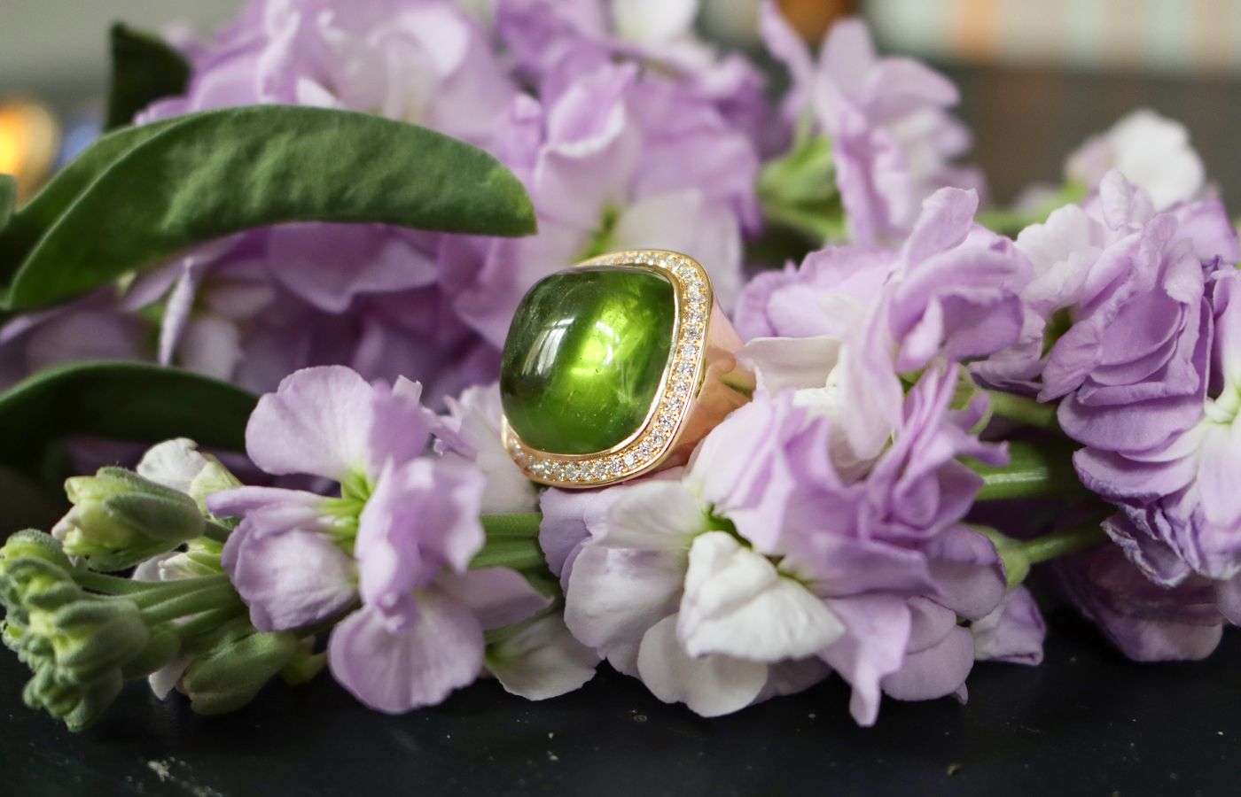 Charlotte Reedtz Jewellery Magic Wish ring in 18k yellow gold with a peridot cabochon and diamond halo