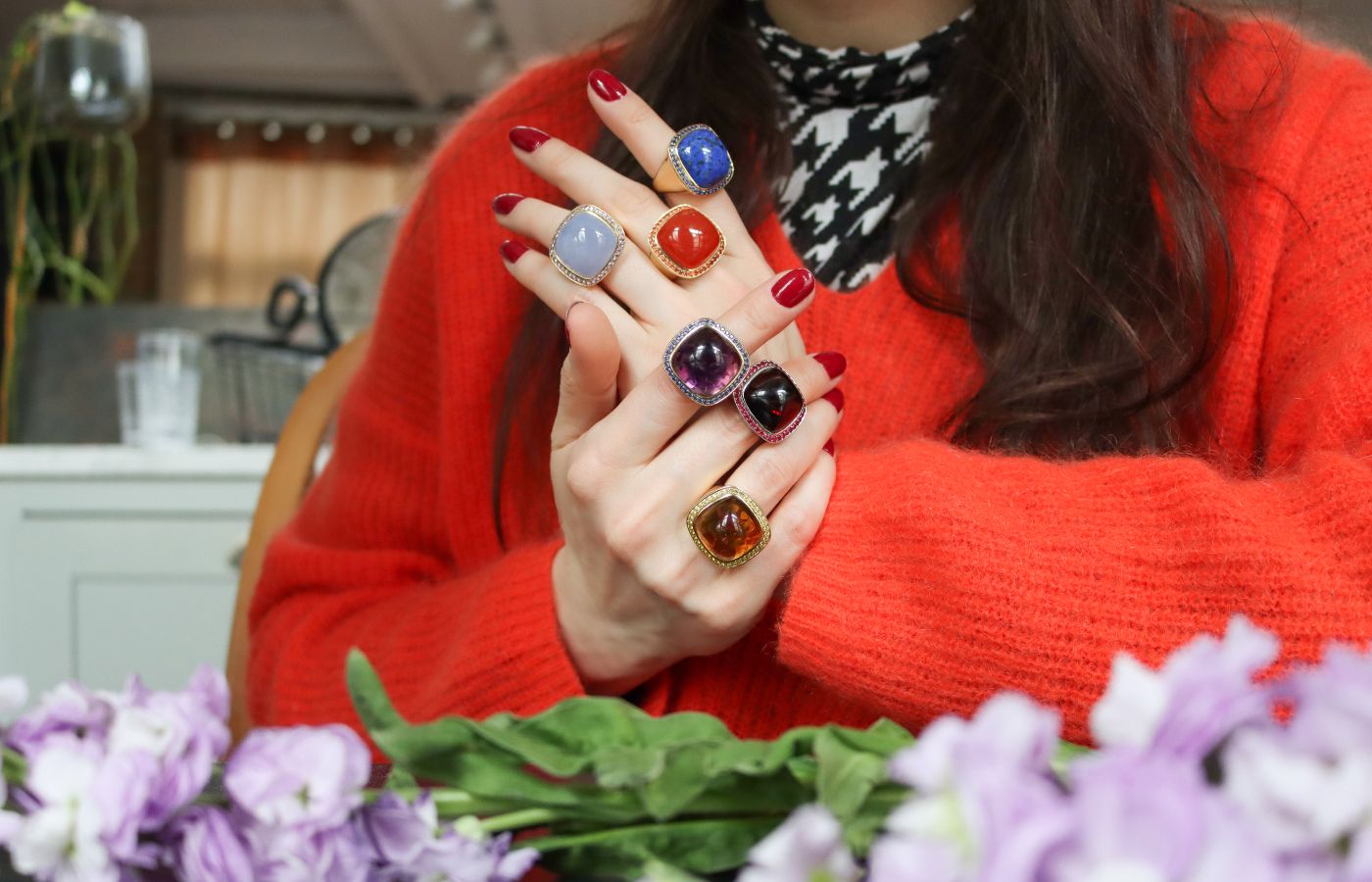 Katerina Perez wears multi-coloured Magic Wish rings by Charlotte Reedtz Jewellery