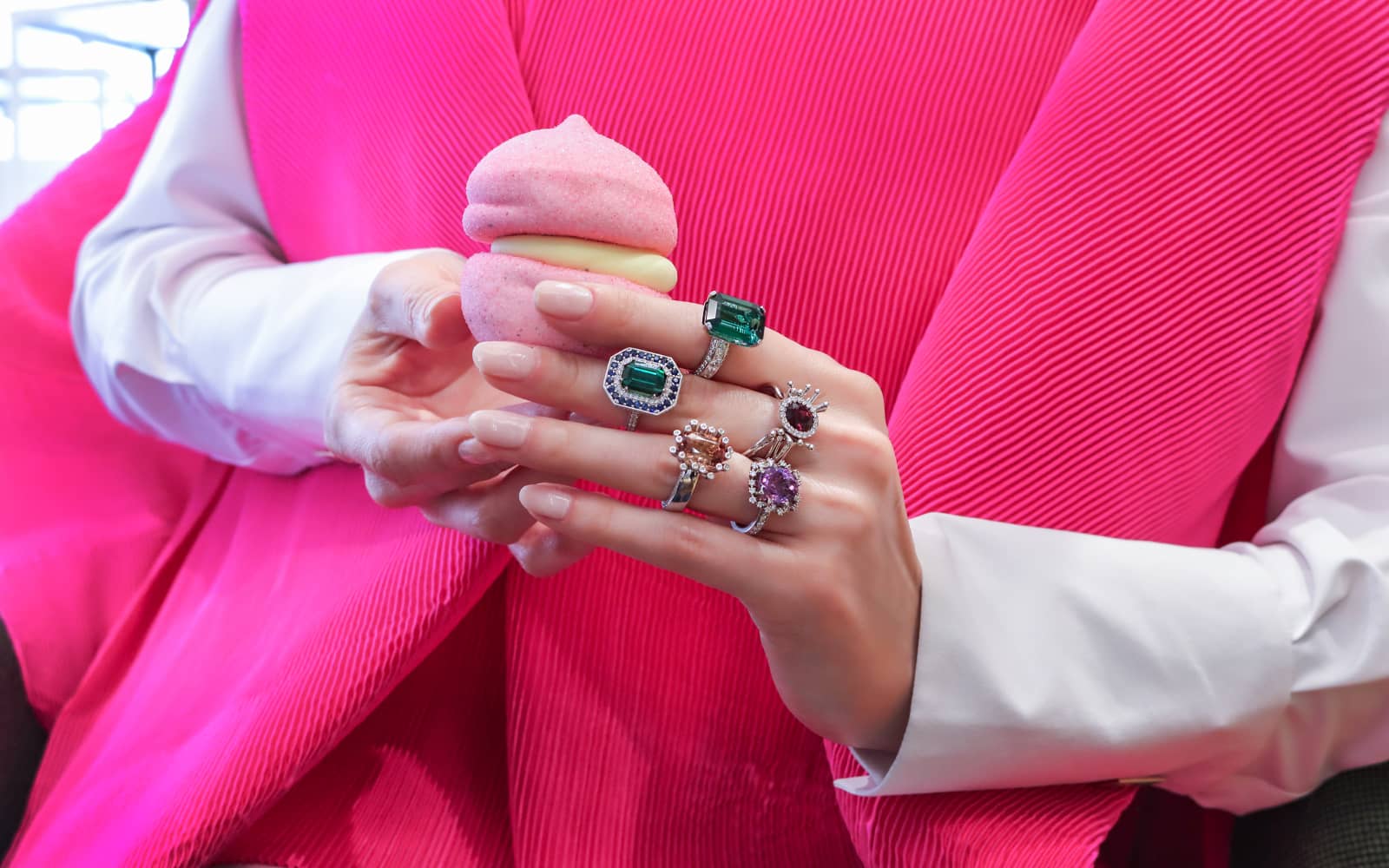 Katerina Perez wears coloured gemstone rings by Korbička Šperky