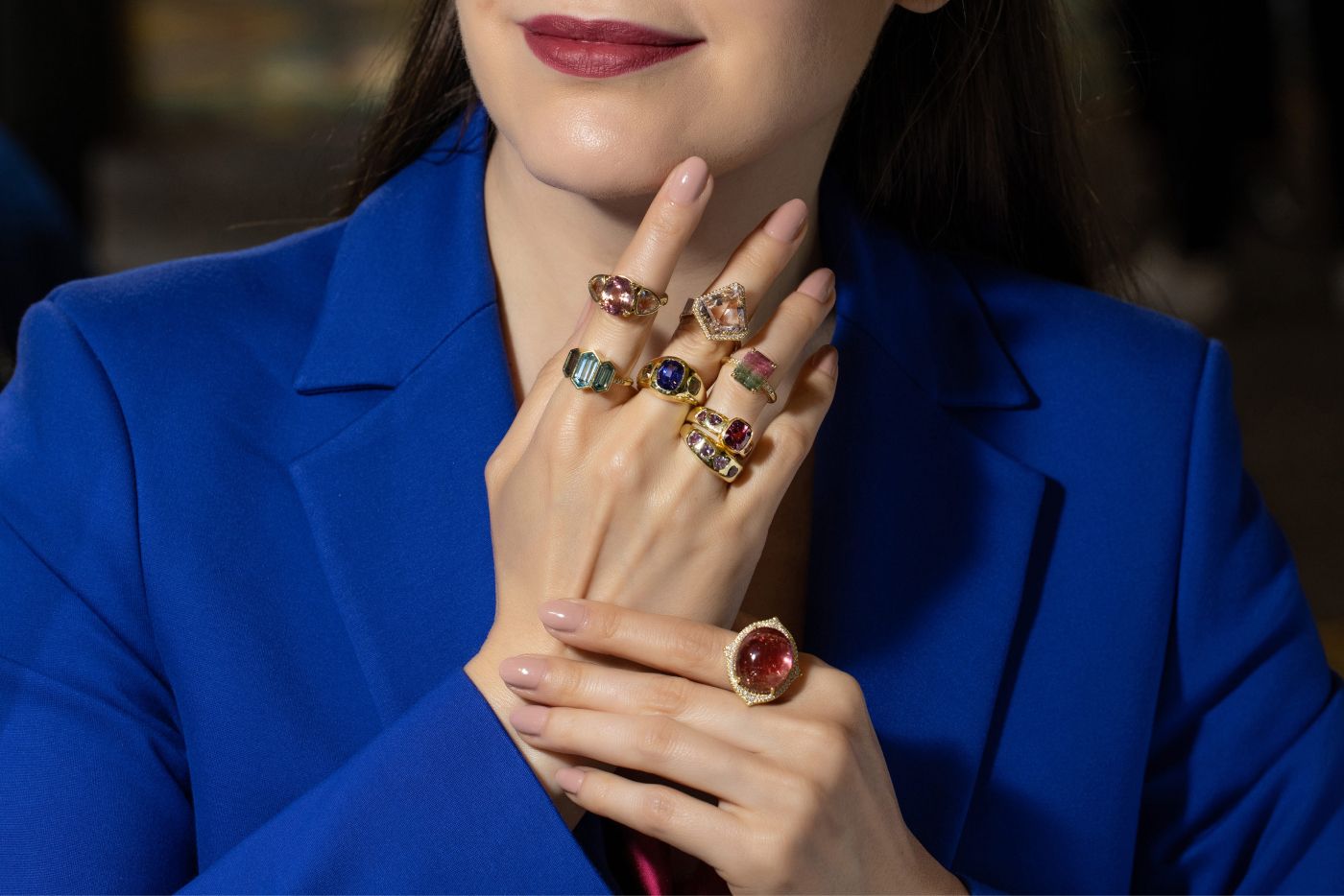 Katerina Perez wearing a selection of Lauren K. Cocktail rings featuring tourmalines, morganites, heart-shaped spinels, tanzanite and blue zircon