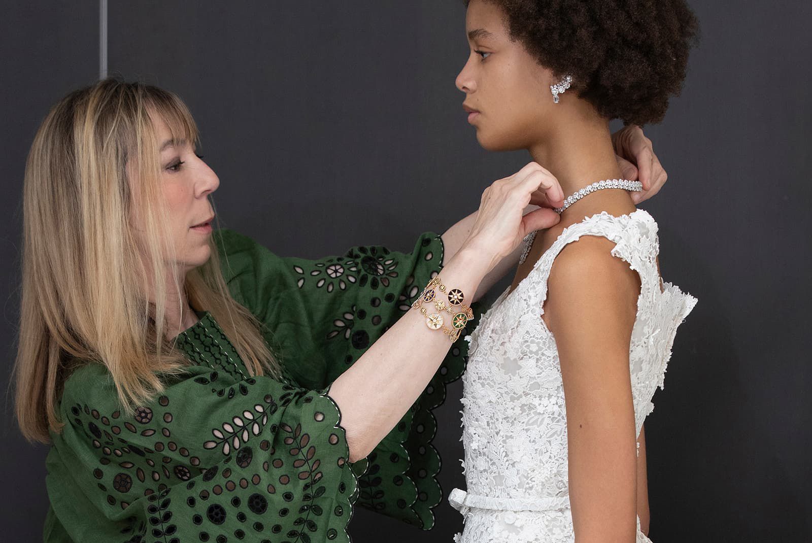Dior Joaillerie's creative director Victoire de Castellane adjusting on a model a High Jewellery necklace in white gold and diamonds from the Les Jardins de la Couture High Jewellery collection 