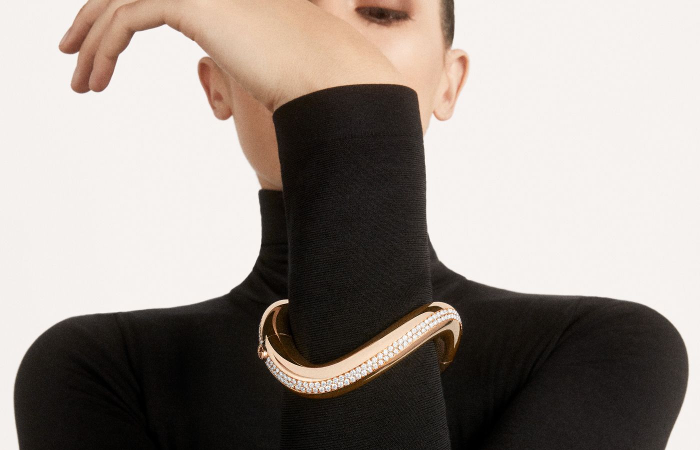  Model wearing Pomellato Dama bracelet in rose gold and diamonds from the Ode to Milan High Jewellery collection