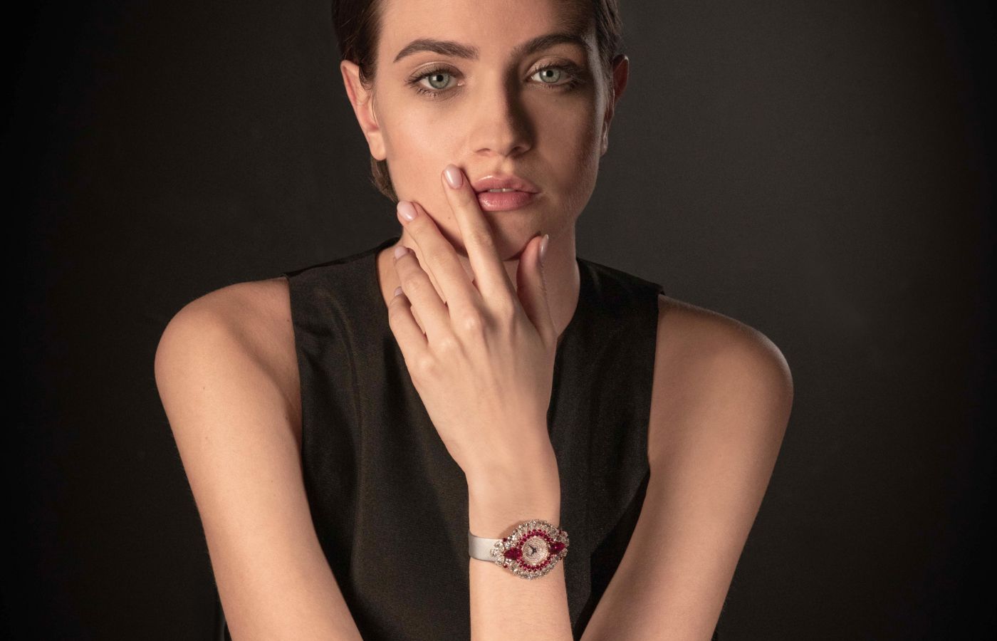 Model wearing Chopard Red Carpet High Jewellery watch in gold, rubies and diamonds