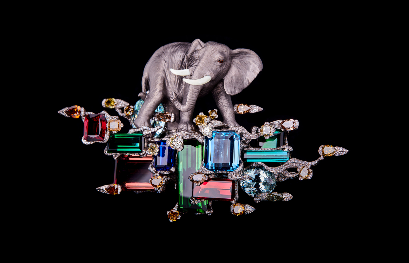 Wallace Chan The Beauty of Greatness brooch with a carved titanium elephant, green tourmaline, rubellite, aquamarine, tanzanite, fancy-coloured diamonds, colourless diamonds, obsidian, yellow sapphire and pearls in The Wallace Chan Porcelain and titanium