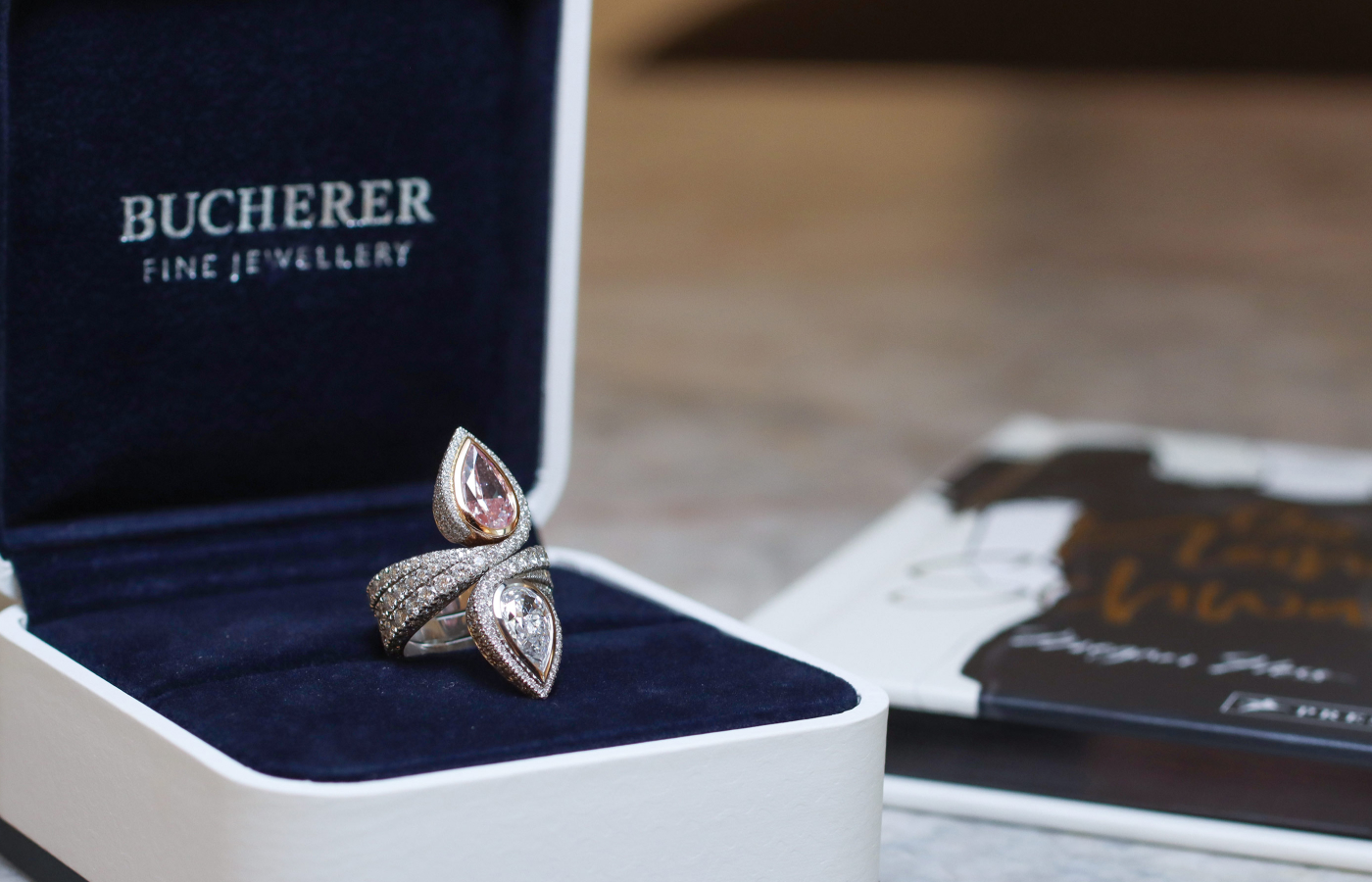 Bucherer Fine Jewellery Toi & Moi ring in platinum and diamond, featuring a fancy intense pink pear-cut diamond