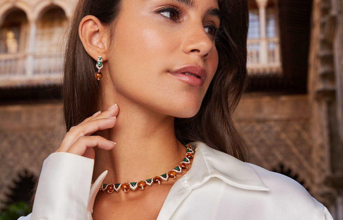 A model wears the Al Zain Raneen necklace and matching Raneen earrings, with more than 40 carats of citrine cabochons, 10 carats of malachite and nearly 3 carats of diamonds in in 18k yellow gold, from the Jena High Jewellery collection 