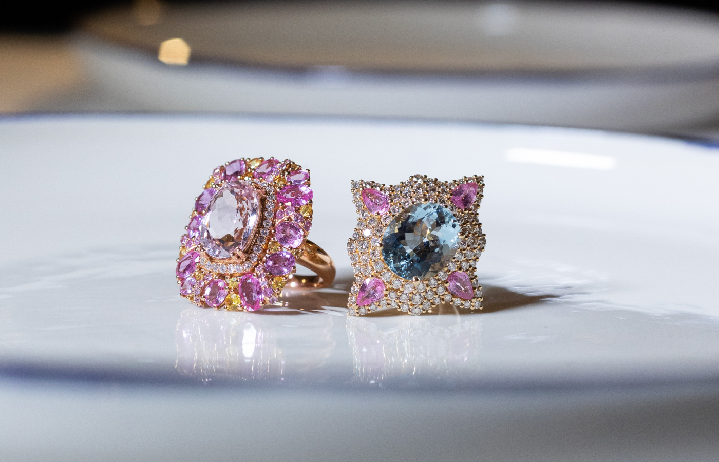 ZARIG cocktail rings including the Aurelia design (right) with a 7.29-carat aquamarine, 1.73 carats of pink sapphire and 2.14 carats of diamonds in 18k yellow gold 