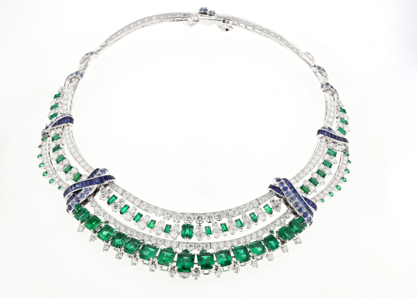 The Quatre Chemins necklace (2019) showcases white gold, platinum, sapphires, and 16 emerald-cut Zambian emeralds (27.79 carats). The necklace is inspired by the fairy tale “Town Musicians of Bremen,” collected and popularised by the German folklorists Brothers Grimm. In the story, four animals meet at a crossroads, the “Four Paths” that give this stunning necklace its name. Photo: Van Cleef & Arpels