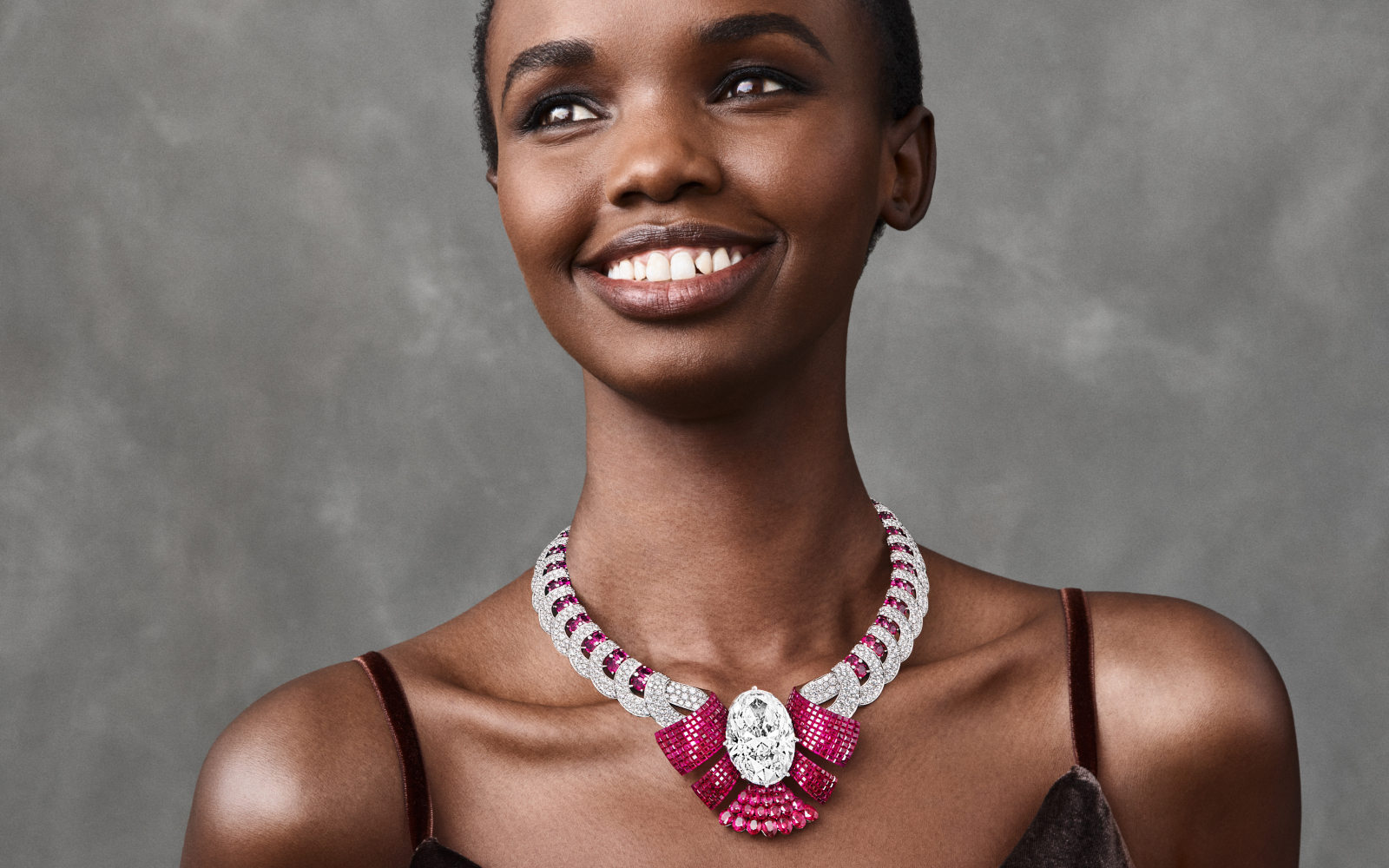 Model wearing Van Cleef & Arpels necklace in ruby and diamond from the Legend of Diamond high jewellery collection 