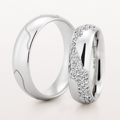 Christian Bauer matching bands for him and her in white gold and diamonds